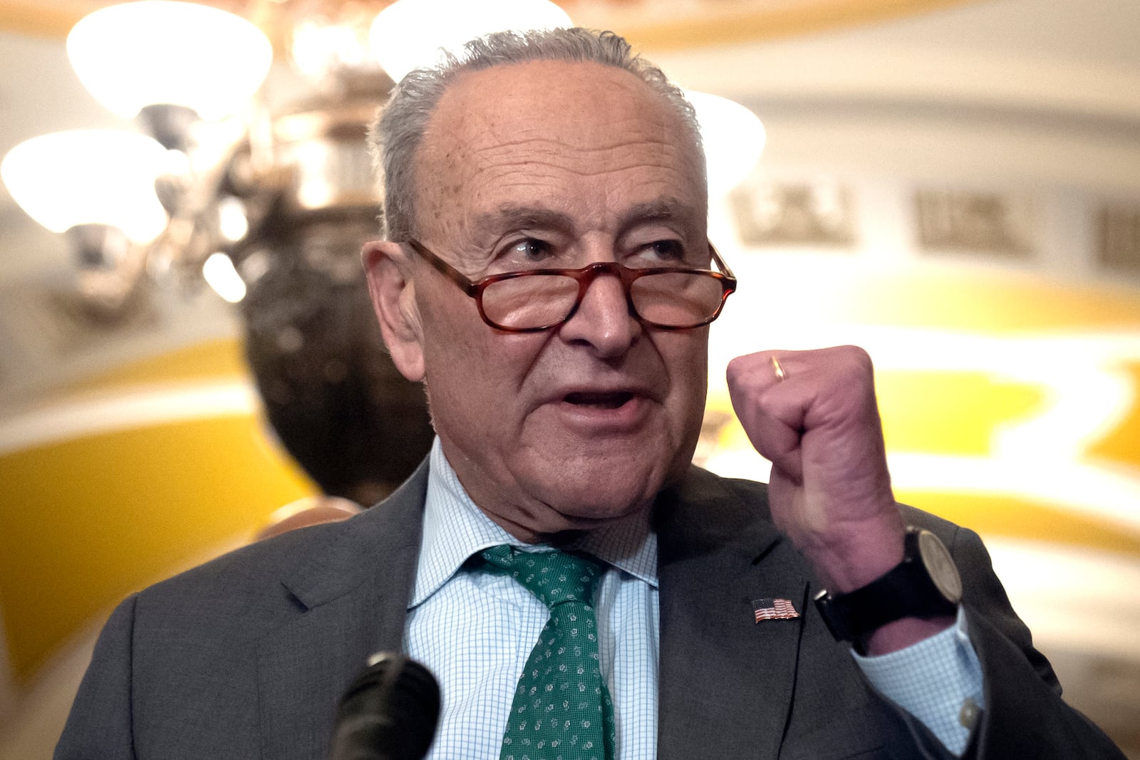 Sen. Charles Schumer, D-N.Y., speaks to reporters after a Senate policy luncheon on Capitol Hill, Tuesday, March 11, 2025, in Washington. (AP Photo/Mark Schiefelbein)