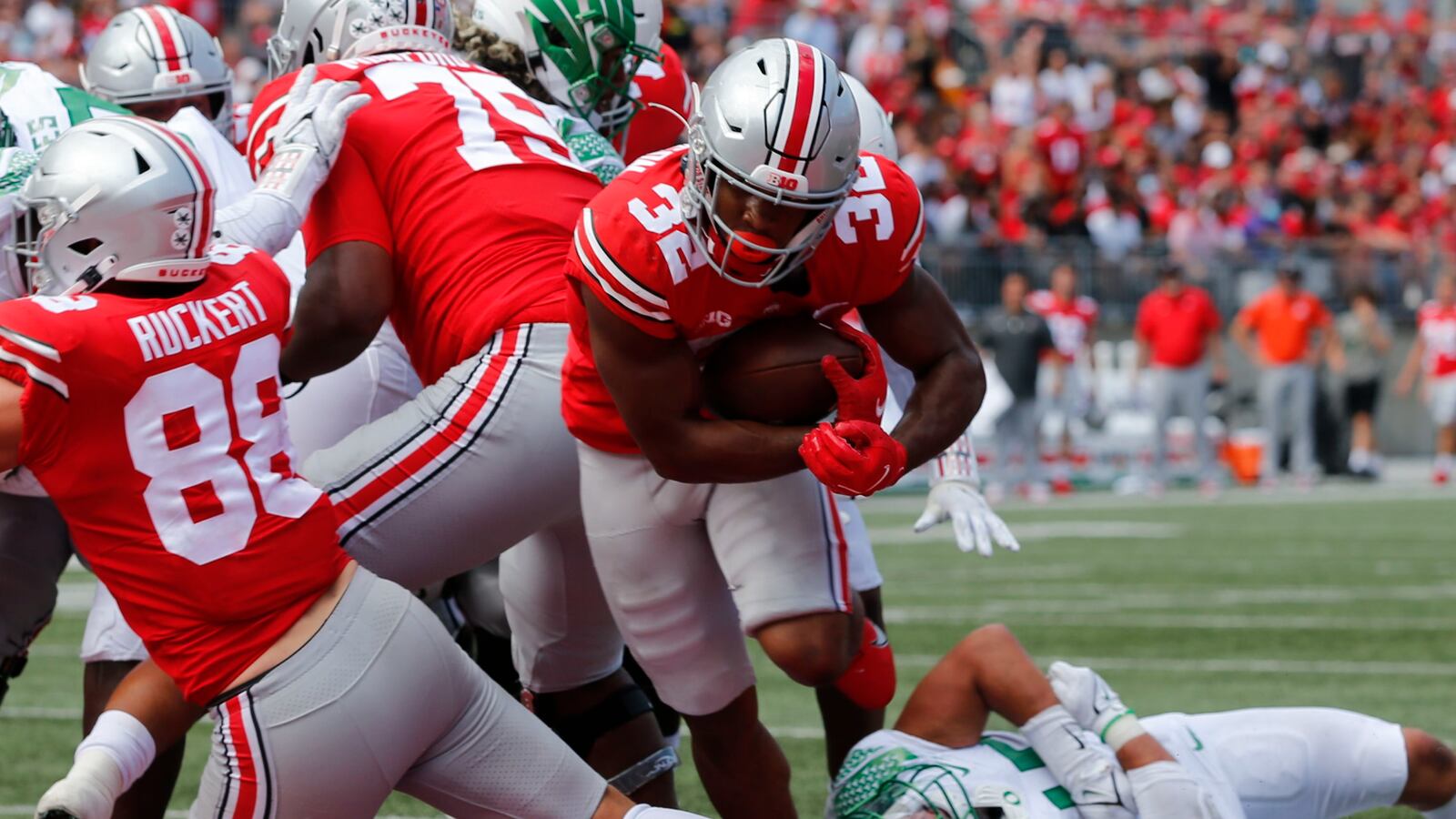 Ohio State running back TreVeyon Henderson, right, crosses the goal line for a touchdown against Oregon during the second half of an NCAA college football game Saturday, Sept. 11, 2021, in Columbus, Ohio. Oregon won 35-28. (AP Photo/Jay LaPrete)