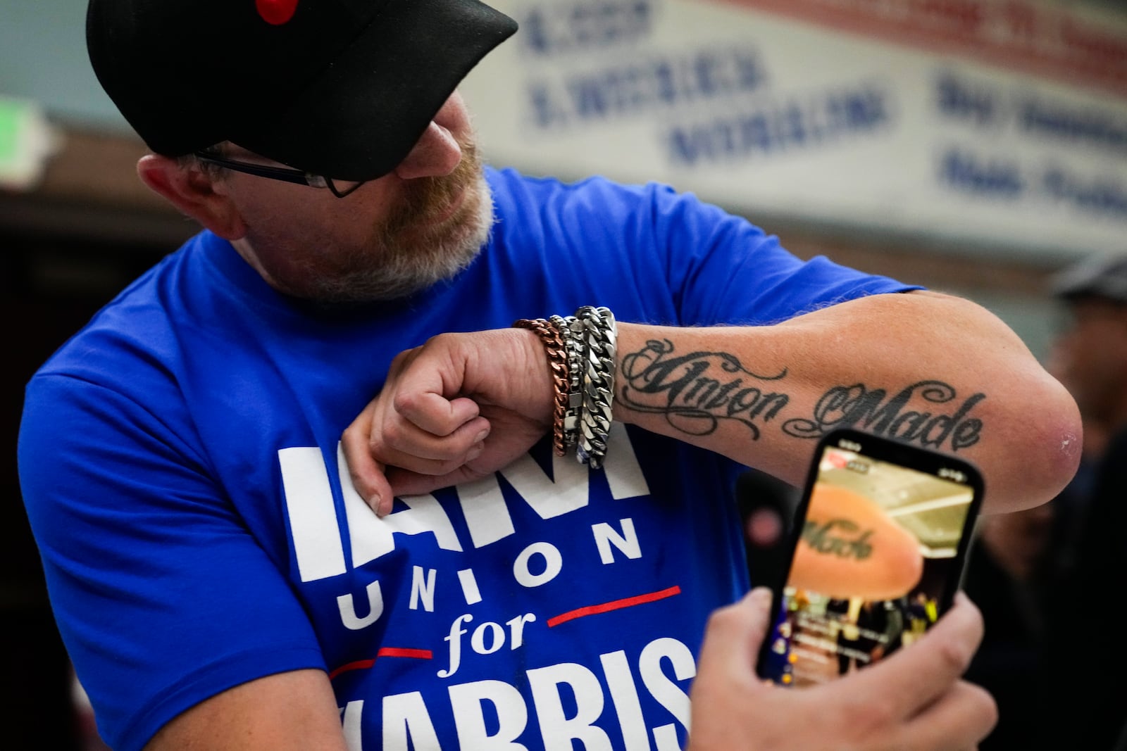 Ed Lutgen shows off his tattoo while waiting to hear the results of the union vote on a new contract offer from Boeing, Monday, Nov. 4, 2024, at IAM District 751 Union Hall in Seattle. (AP Photo/Lindsey Wasson)