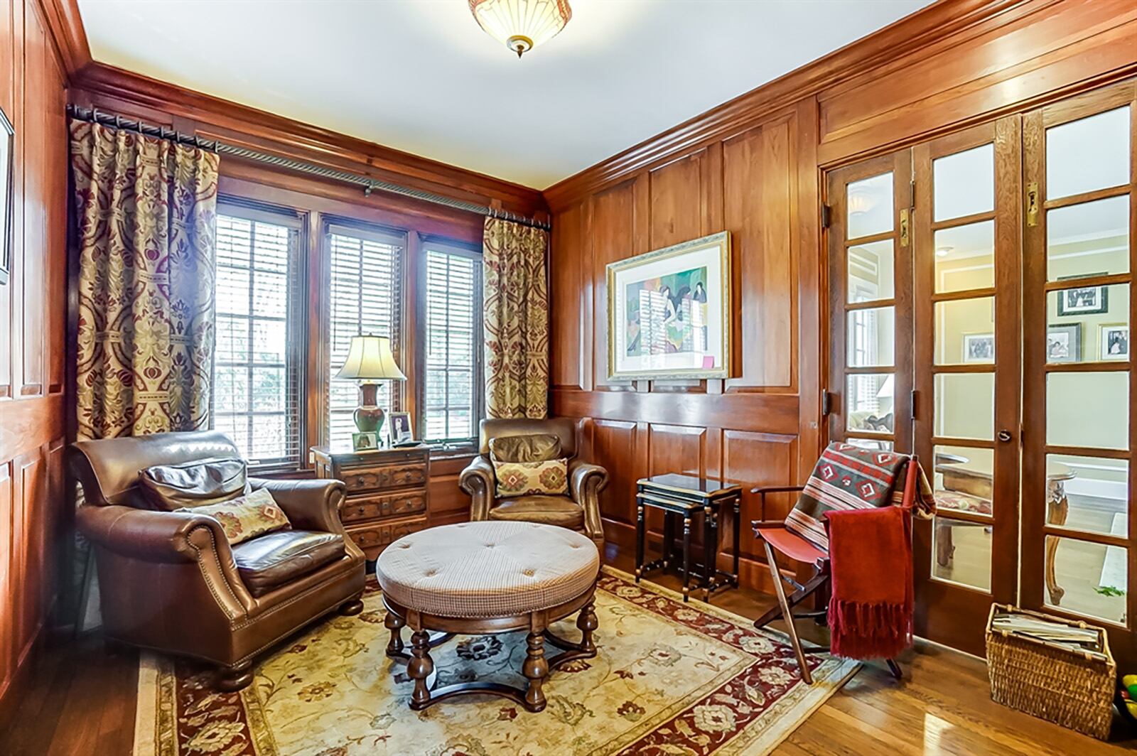 Accessible from the foyer and through French doors from the living room is a study with cherry-paneled walls. CONTRIBUTED PHOTO