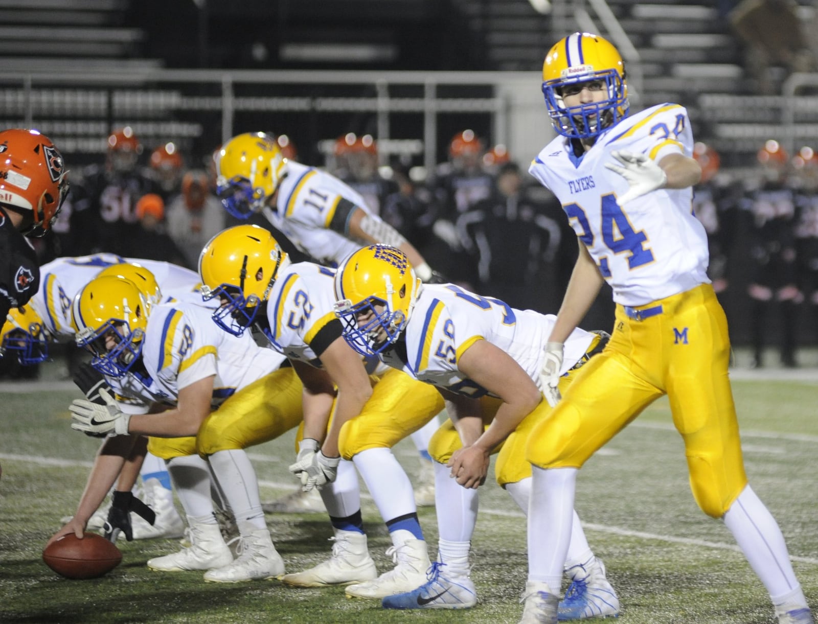 At 6 feet 4, Nick Tangeman (24) makes a big Flyers’ target. He had nine catches for 167 yards and two TDs in a 40-19 defeat of Coldwater at Sidney on Friday, Nov. 16, 2018. MARC PENDLETON / STAFF