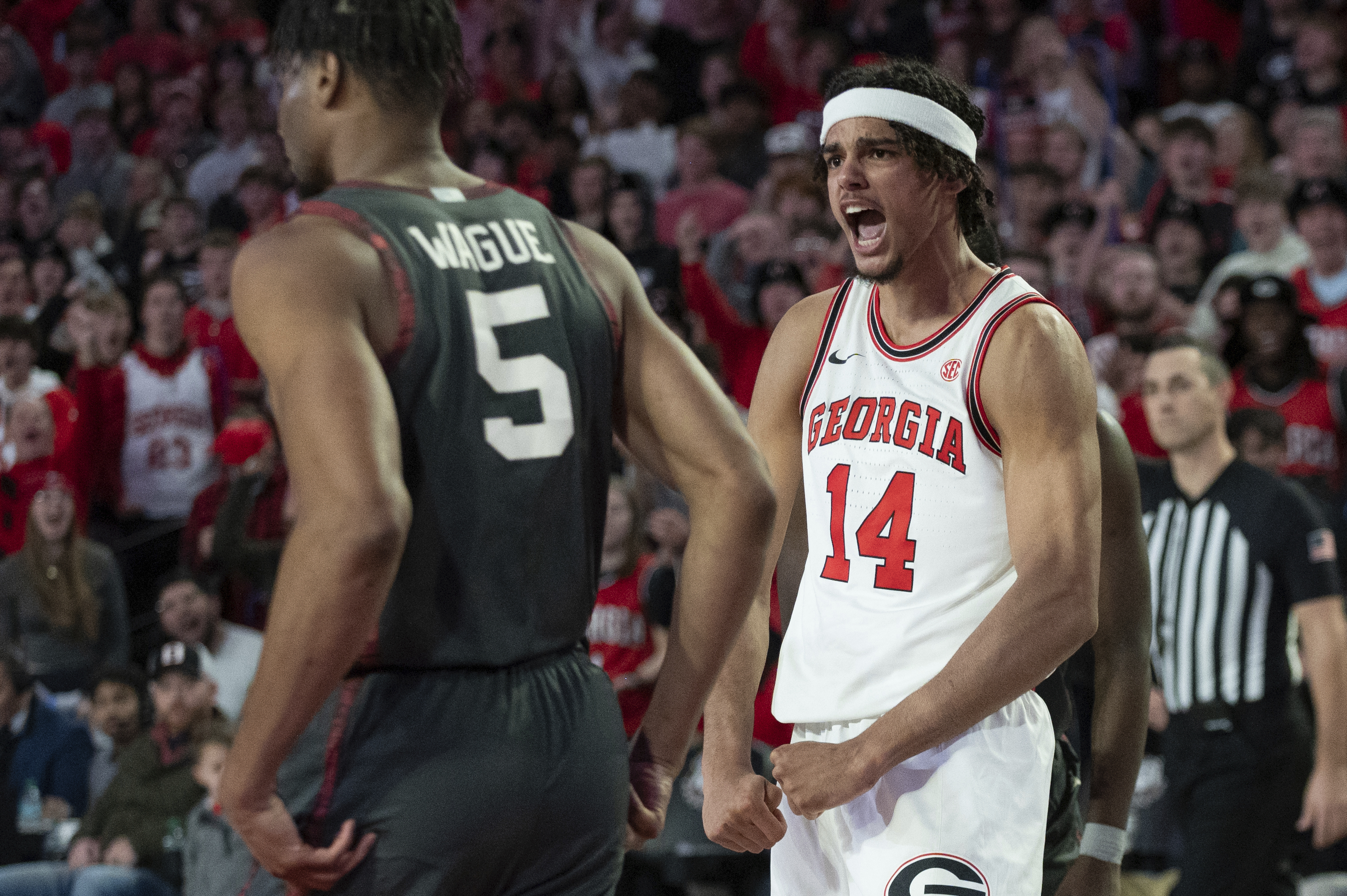 Georgia forward Asa Newell (14) reacts during the first half of an NCAA college basketball game against Oklahoma, Saturday, Jan. 11, 2025, in Athens, Ga. (AP Photo/Kathryn Skeean)