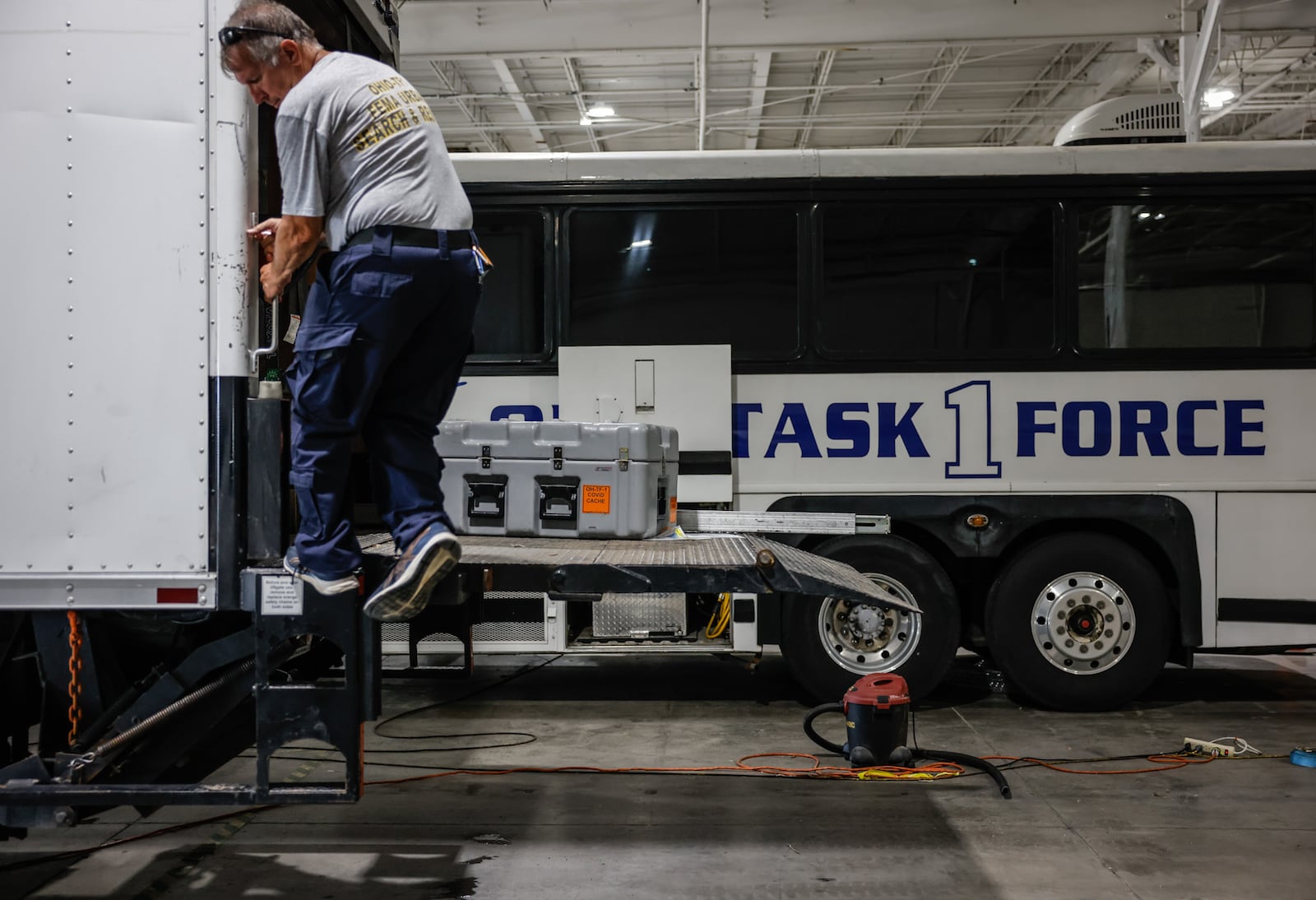 Kevin Ganger, Ohio Task Force 1 logistics manager, a captain for the Piqua Fire Department, checks equipment before a 16-member water-capable search and rescue team deploys Thursday evening, July 28, 2022, to eastern Kentucky. Devastating flooding has left people trapped in their homes and others unaccounted for. JIM NOELKER/STAFF