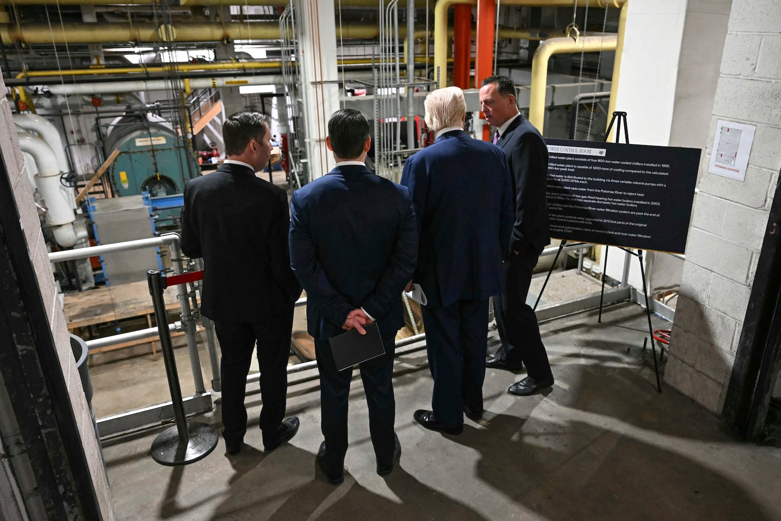 President Donald Trump talks with Kennedy Center Board of Trustees president Richard Grenell, right, as he tours the John F. Kennedy Center for the Performing Arts in Washington, Monday, March 17, 2025. (Jim Watson, Pool via AP)