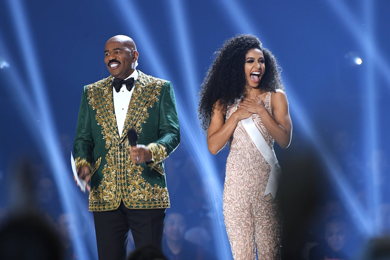 ATLANTA, GEORGIA - DECEMBER 08: (EDITORIAL USE ONLY) Steve Harvey interviews Miss USA Cheslie Kryst onstage at the 2019 Miss Universe Pageant at Tyler Perry Studios on December 08, 2019 in Atlanta, Georgia. (Photo by Paras Griffin/Getty Images)