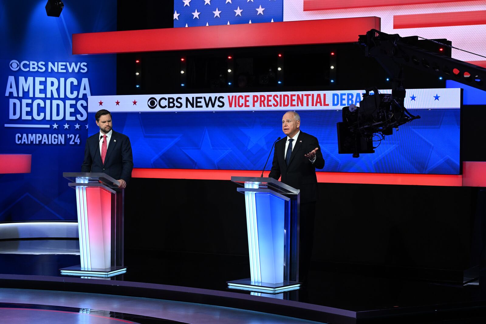  Gov. Tim Walz of Minnesota speaks as Sen. JD Vance (R-Ohio) listens during the vice-presidential debate at the CBS Broadcast Center in New York on Tuesday, Oct. 1, 2024. (Kenny Holston/The New York Times) 