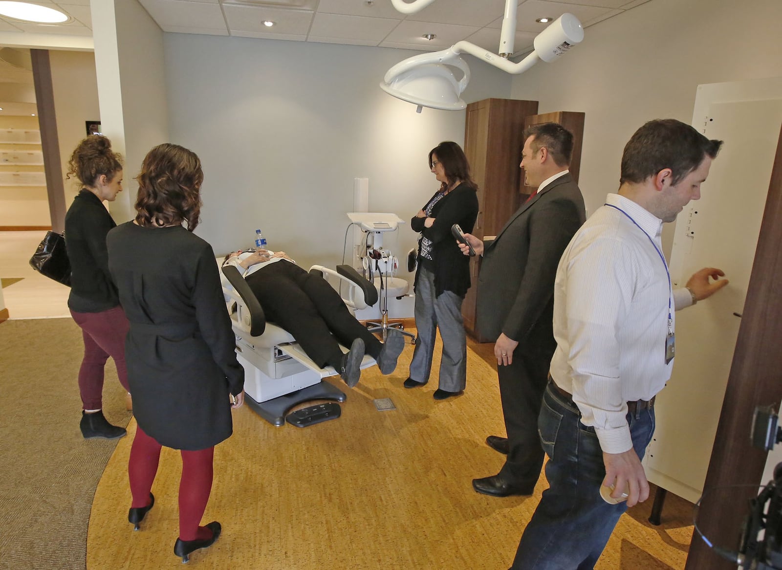 The Midmark Corporation in Versailles designs and manufactures medical equipment for doctors, dentists and veterinarians including powered exam chairs,furniture and workflow for exam and minor surgical procedure rooms. Customers and company representatives sample a new barrier-free exam chair in Midmark’s Education Center. TY GREENLEES / STAFF