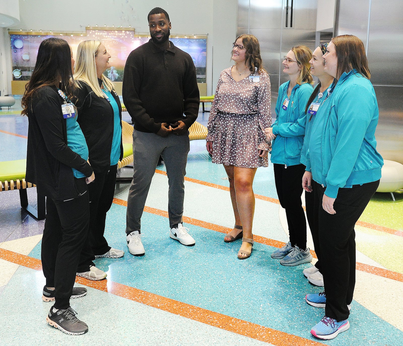 NBA veteran, University of Kentucky Men’s Basketball Champion, and stuttering advocate Michael Kidd-Gilchrist, center, and Dayton Children's patient ambassador, Carah Brown, talked with the Speech Language Pathology team Thursday, Nov. 2, 2023 at Dayton Children’s Hospital. Kidd-Gilchrist is on a stuttering advocacy tour through Ohio. MARSHALL GORBY\STAFF