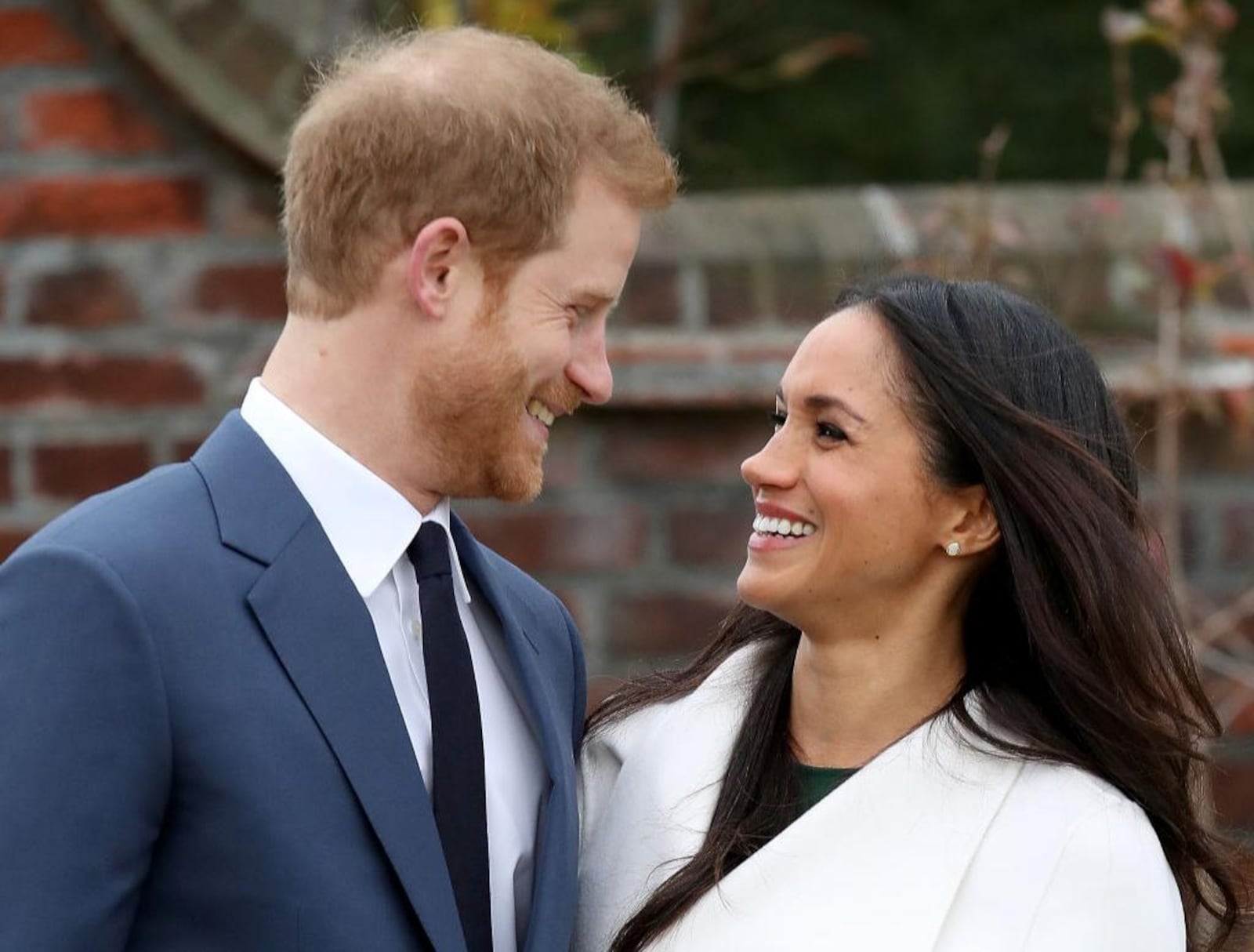 Prince Harry and Meghan Markle during an official photocall to announce their engagement at The Sunken Gardens at Kensington Palace on November 27, 2017 in London, England. The couple are tying the knot on Saturday in a ceremony in St. George’s Chapel at Windsor Castle.