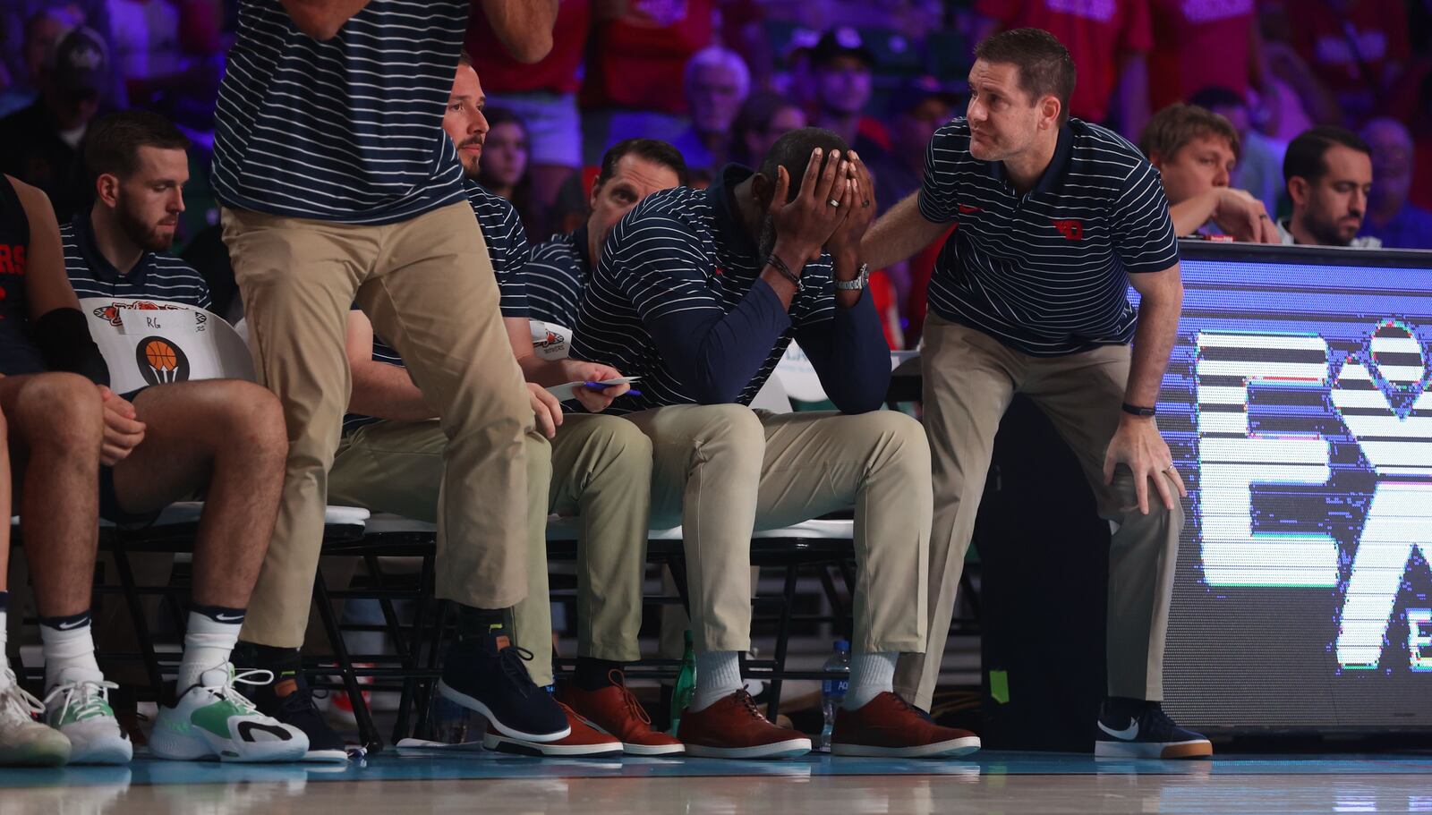 Dayton's Anthony Grant puts his head in his hands during a game against N.C. State on Thursday, Nov. 24, 2022, in the consolation round of the Battle 4 Atlantis at Imperial Arena at the Paradise Island Resort in Nassau, Bahamas. David Jablonski/Staff