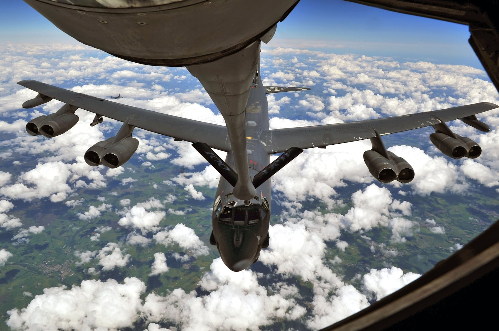 A B-52 Stratofortress deployed to RAF Fairford, England from Barksdale Air Force Base, La., performs air refueling with a KC-135 Stratotanker from RAF Mildenhall, England June 11, 2014, over the United Kingdom. The B-52 fuel tank can hold up to 312,197pounds of fuel during the refueling mission. (U.S. Air Force photo by Senior Airman Christine Griffiths/Released)