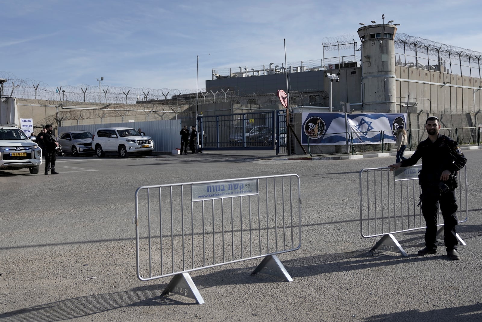 Israeli soldiers stand outside Ofer military prison near Jerusalem on Sunday, Jan. 19, 2025. (AP Photo/Mahmoud Illean)