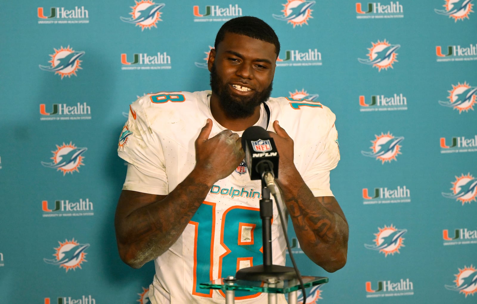 Miami Dolphins quarterback Tyler Huntley (18) speaks during a news conference after an NFL football game against the Cleveland Browns Sunday, Dec. 29, 2024, in Cleveland. (AP Photo/David Richard)