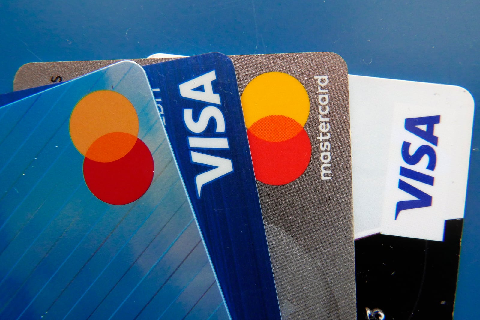 FILE - Credit card rewards or other incentives don’t hold as much value when you’re carrying a hefty balance and paying steep interest charges. (AP Photo/John Raoux, File)