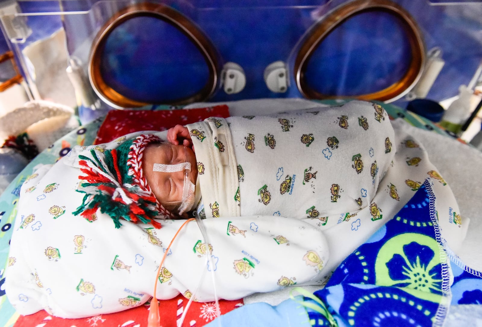 Bradley Wayne Smith rests in his bed Thursday, Dec. 19 in The Berry Women’s Health Pavilion at Miami Valley Hospital in Dayton. Bradley and twin brother Grayson were born at 30 weeks to parents Elyssa Williams and Ryan Smith on Dec. 7 and have been in the NICU at the hospital. Grayson and Bradley both weighed 2 lbs,15oz. at birth. NICK GRAHAM/STAFF