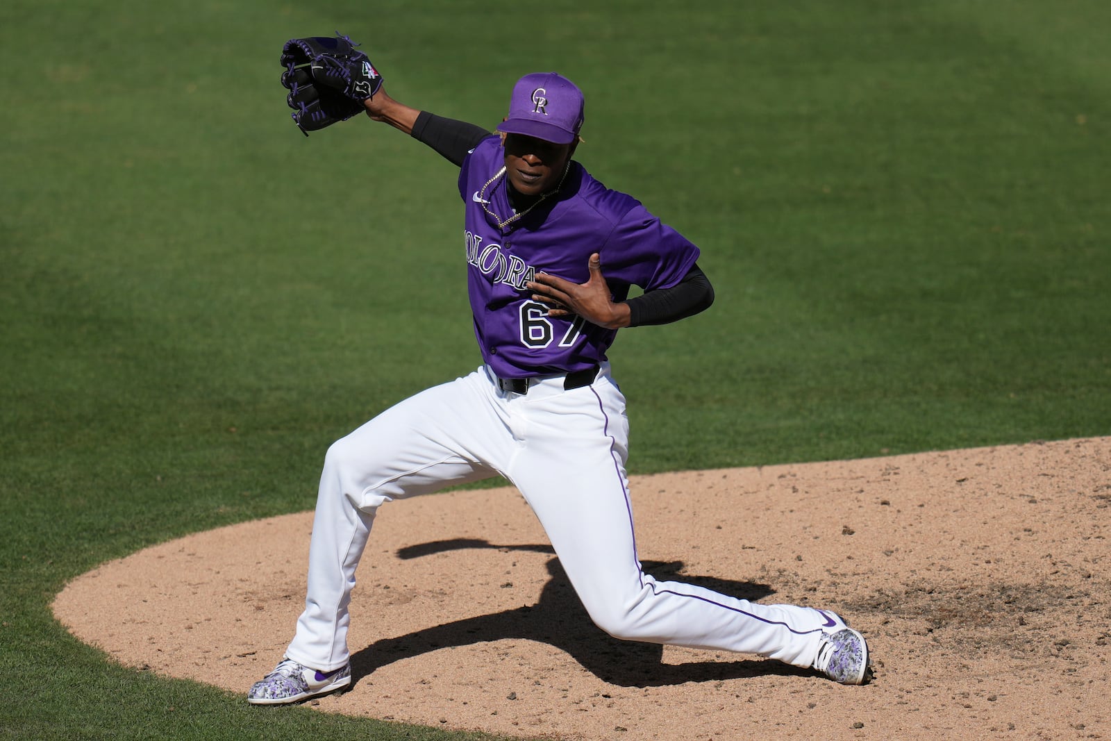 Colorado Rockies pitcher Jefry Yan celebrates a strikeout against Seattle Mariners Jacob Nottingham during the seventh inning of a spring training baseball game, Sunday, March 2, 2025, in Scottsdale, Ariz. (AP Photo/Ross D. Franklin)