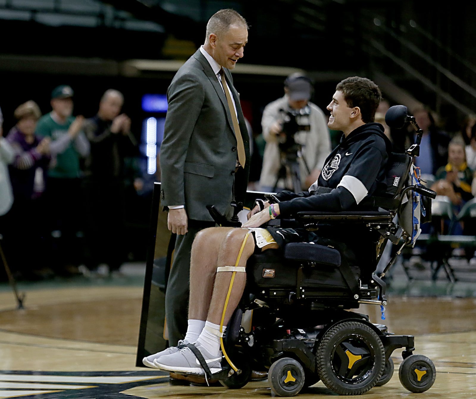 Wright State University head coach Scott Nagy greets Ryan Custer during senior recognition after Wright State’s game against IUPUI at the Nutter Center in Fairborn on Sunday, Feb. 16, 2020. Contributed photo by E.L. Hubbard