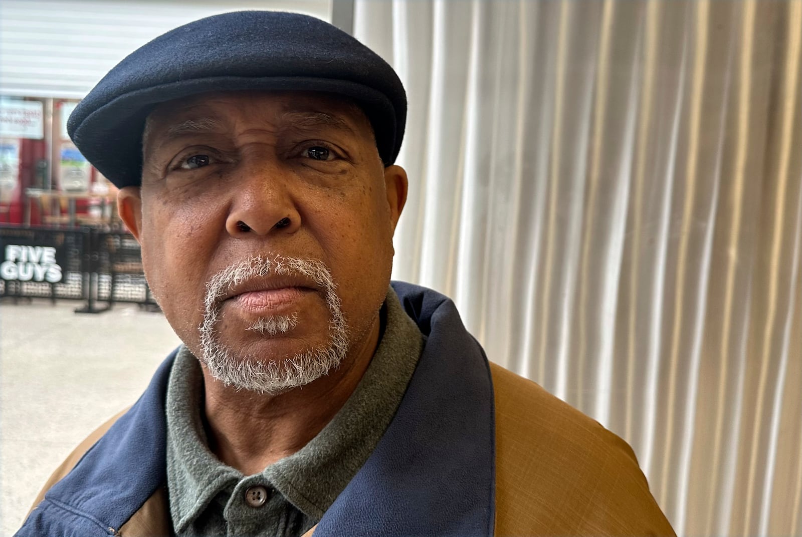 Ricky Thompson, 71, is a retired Army officer who opposes Elon Musk's effort to sharply cut the federal workforce, poses for a photo Feb. 6, 2025, in Urbandale, Iowa. (AP Photo/Thomas Beaumont)