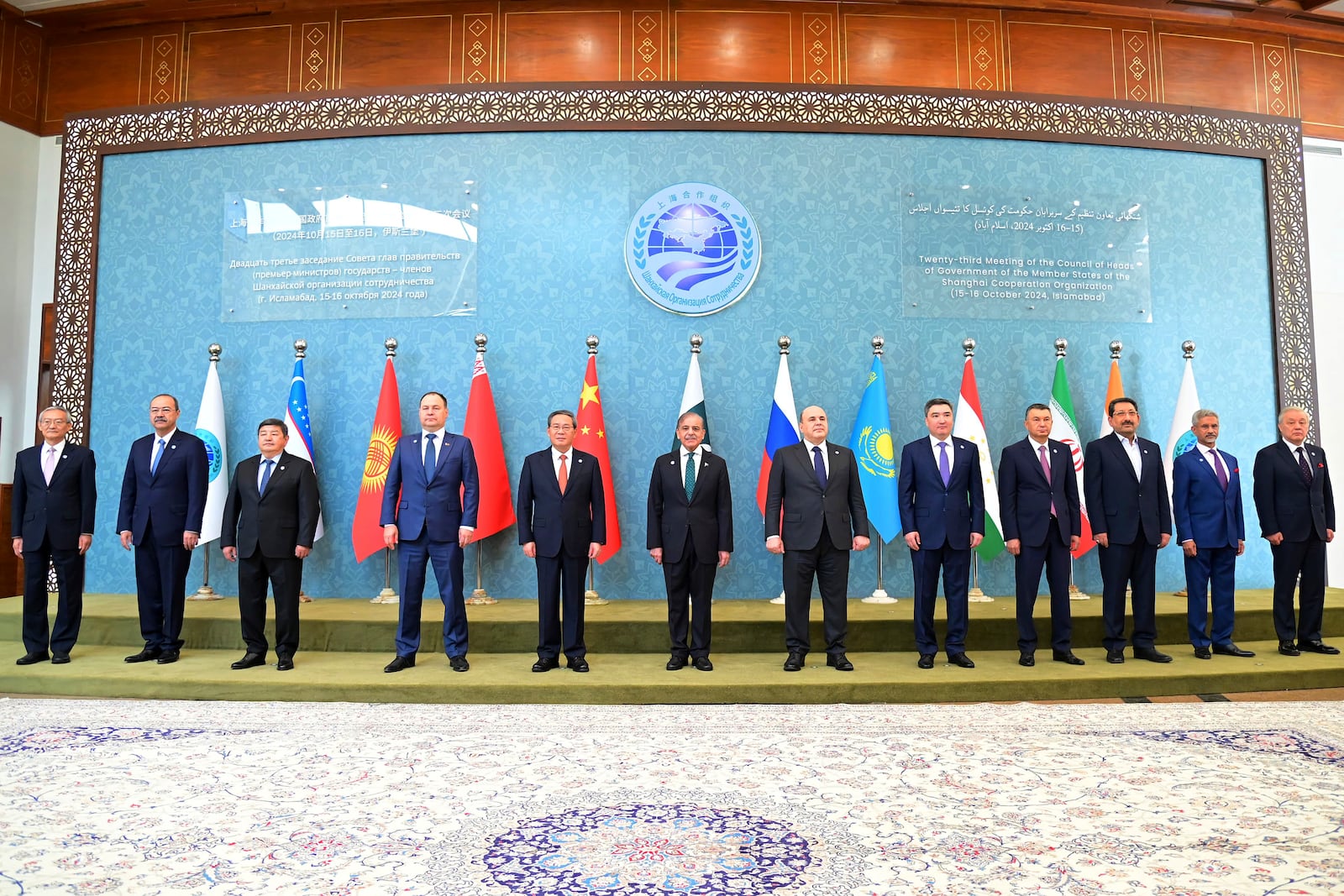 In this photo released by the Press Information Department, Pakistan's Prime Minister Shehbaz Sharif, center, China's Premier Li Qiang, fifth left, Belarus Prime Minister Roman Golovchenko, fourth left, Russian Prime Minister Mikhail Mishustin, sixth right, Kazakhstan's Prime Minister Olzhas Bektenov, fifth right, Tajikistan's Prime Minister Kokhir Rasulzoda, fourth right, and other leaders pose for group photo at the opening session of Shanghai Cooperation Organization (SCO) meeting in Islamabad, Pakistan, Wednesday, Oct. 16, 2024. (Press Information Department via AP)