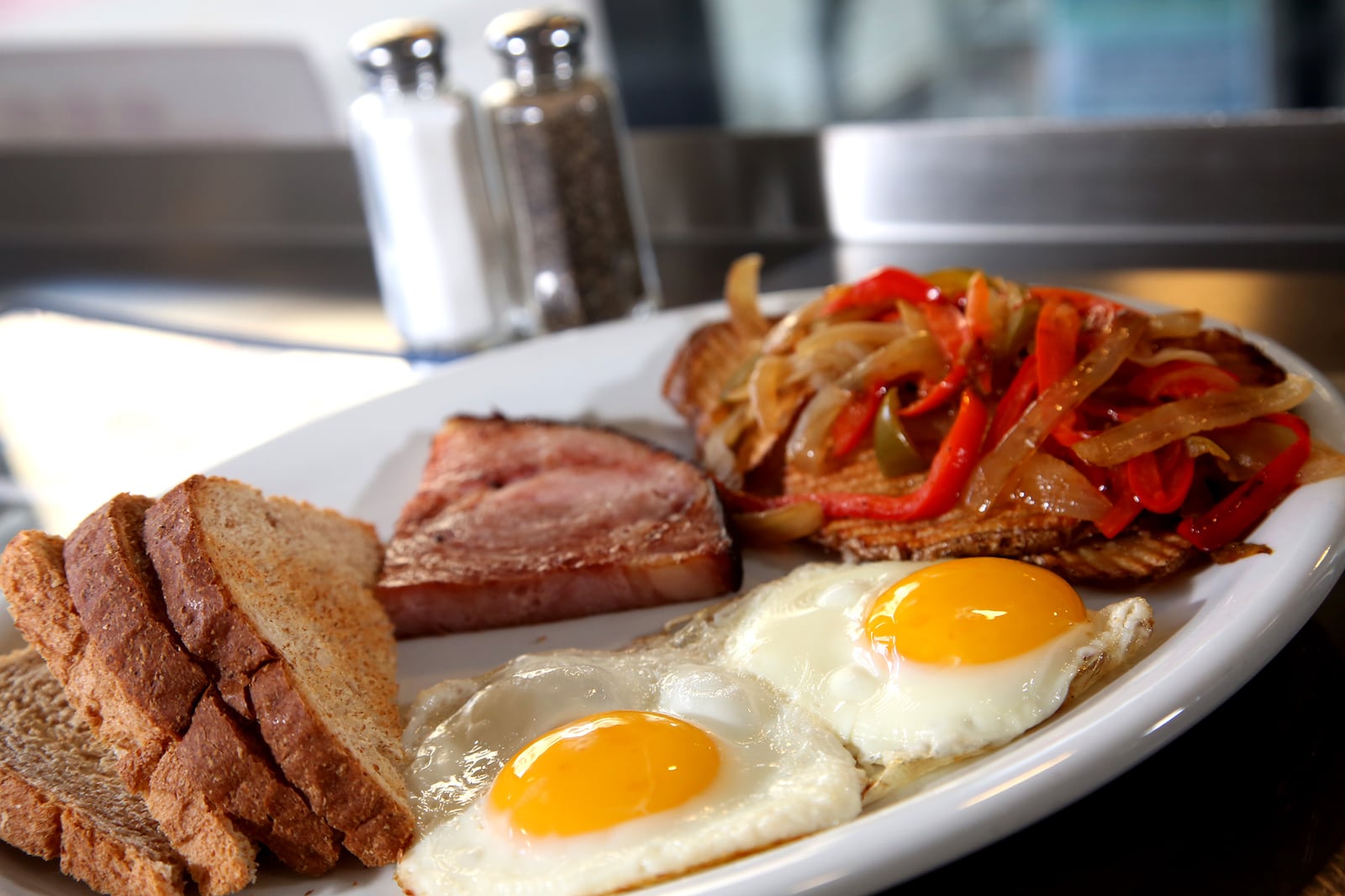 The 416 Special at the 416 Diner in Dayton's Oregon District, has two eggs and a choice of bacon, ham or sausage. The breakfast plates also come with toast and a choice of hash browns or fried potatoes. LISA POWELL / STAFF