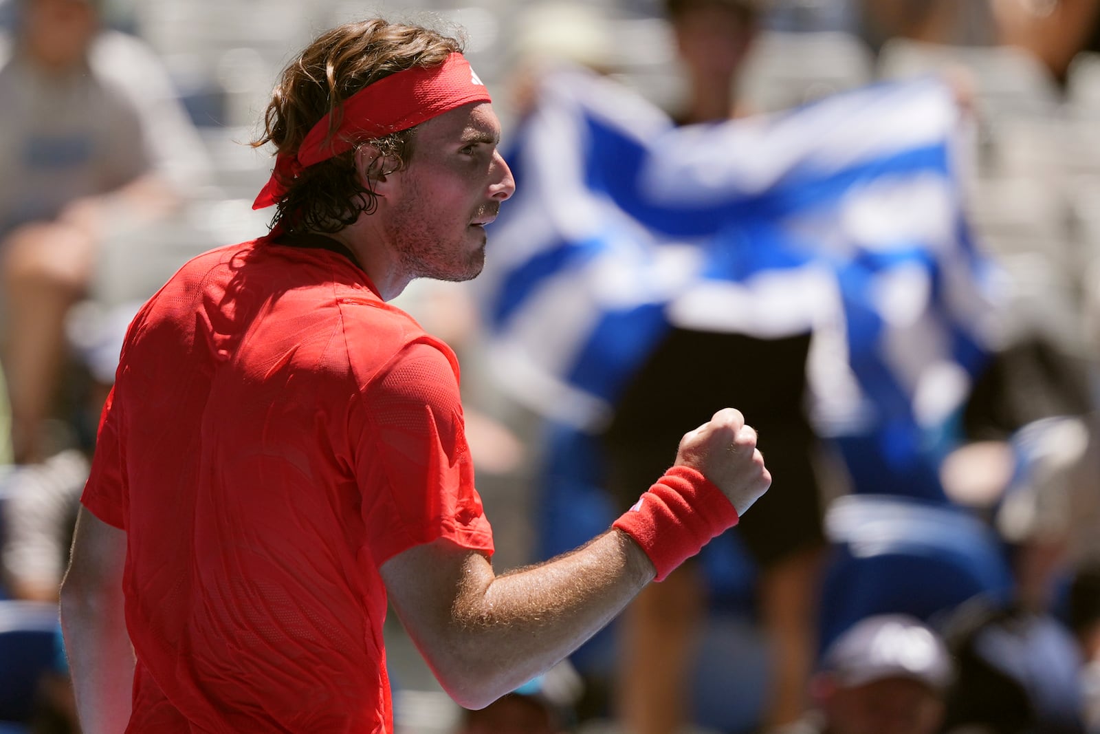 Stefanos Tsitsipas of Greece reacts after winning a point against Alex Michelsen of the U.S. during their first round match at the Australian Open tennis championship in Melbourne, Australia, Monday, Jan. 13, 2025. (AP Photo/Ng Han Guan)