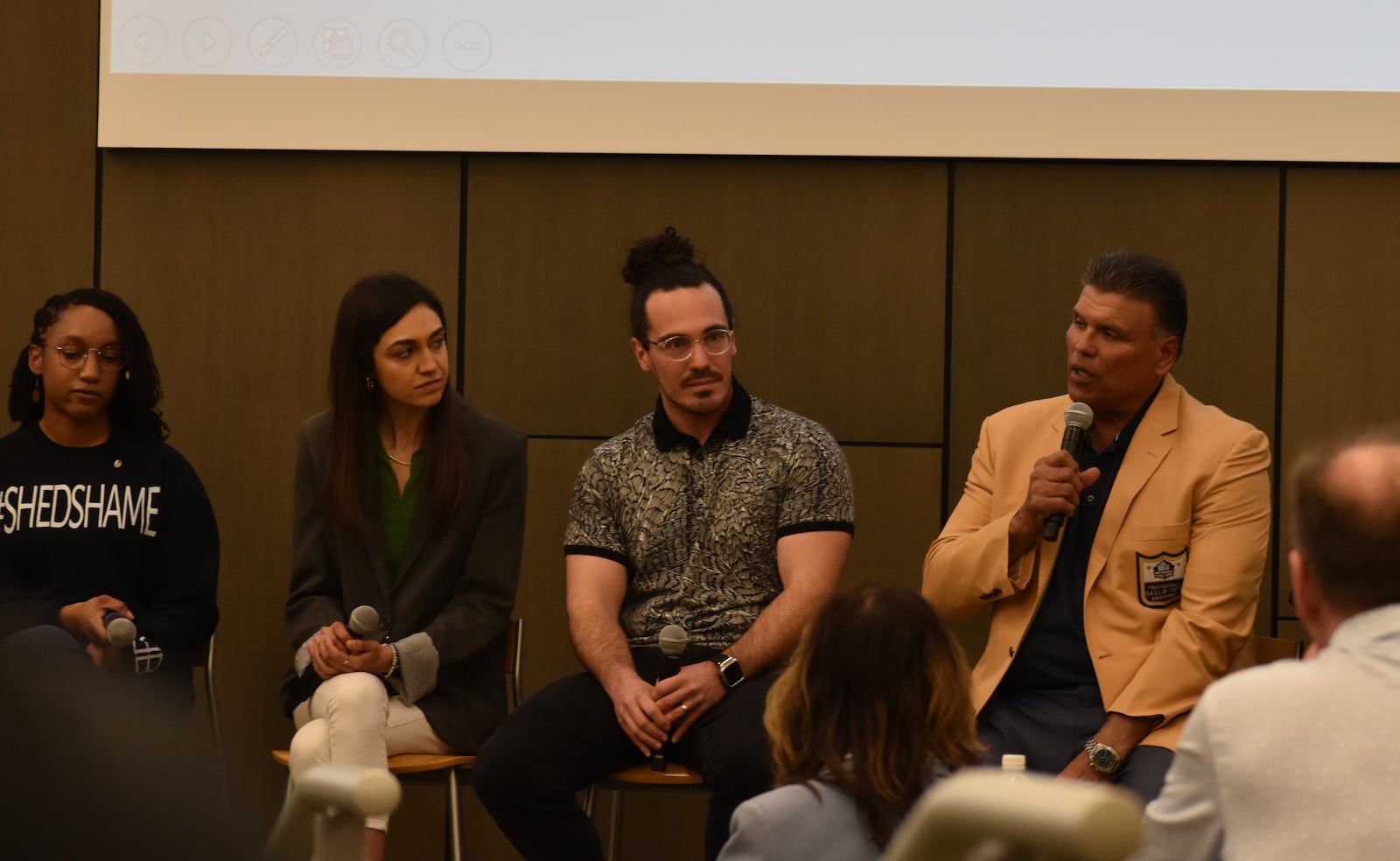 Anthony Muñoz (far right), former offensive tackle for the Cincinnati Bengals who was also inducted into the Pro Football Hall of Fame in 1998, talks about mental health struggles during a Project Blackbird panel event at Wright State University on March 19, 2025. SAM WILDOW/STAFF