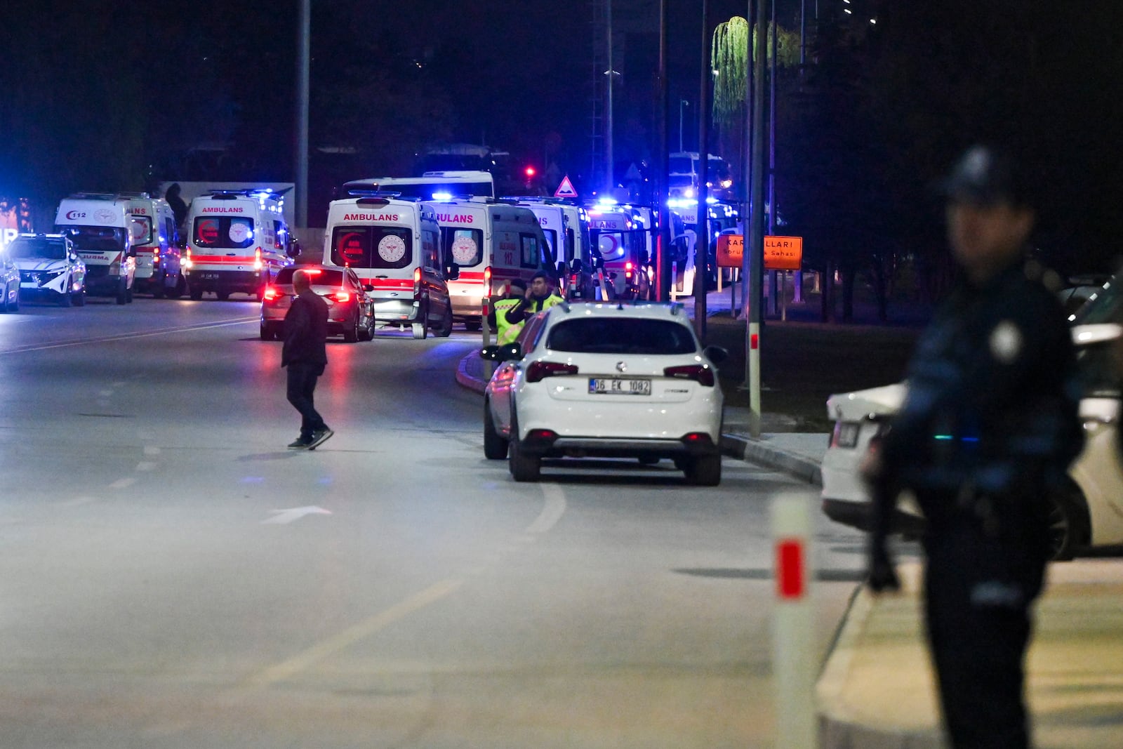 Ambulances wait in line outside of Turkish Aerospace Industries Inc. at the outskirts of Ankara, Turkey, Wednesday, Oct. 23, 2024. (AP Photo/Mert Gokhan Koc)