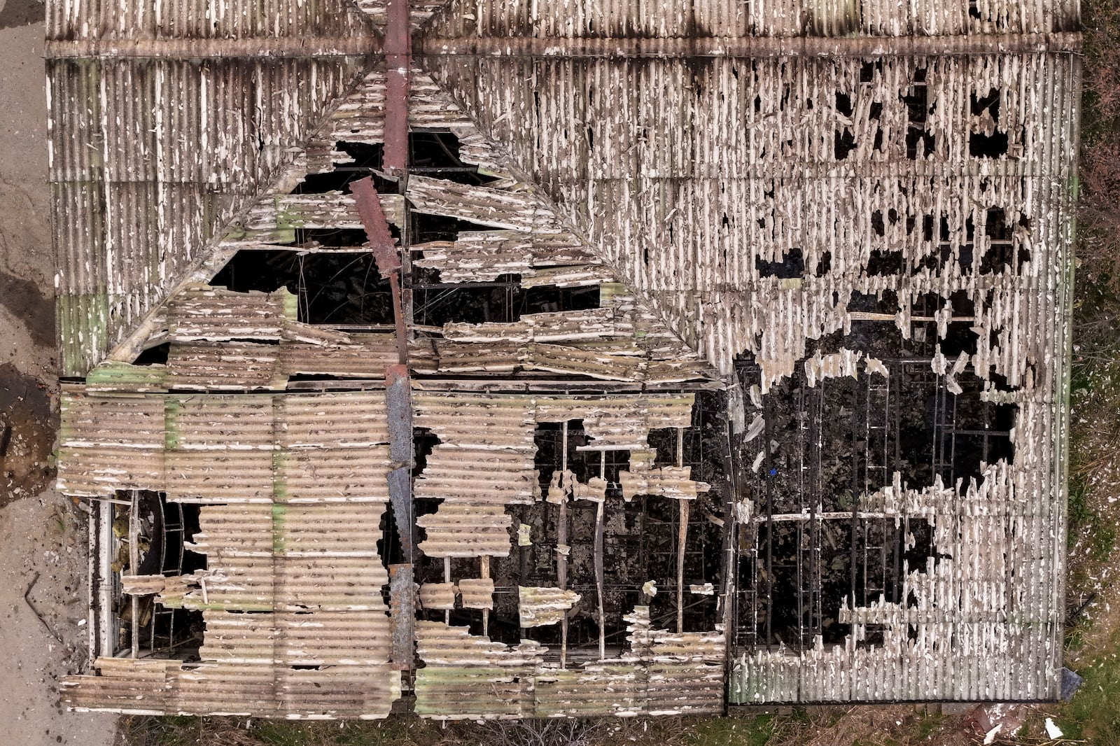 An aerial photograph shows the damaged roof of a nightclub in the town of Kocani, North Macedonia, Sunday, March 16, 2025, following a massive fire in the nightclub early Sunday. (AP Photo/Armin Durgut)