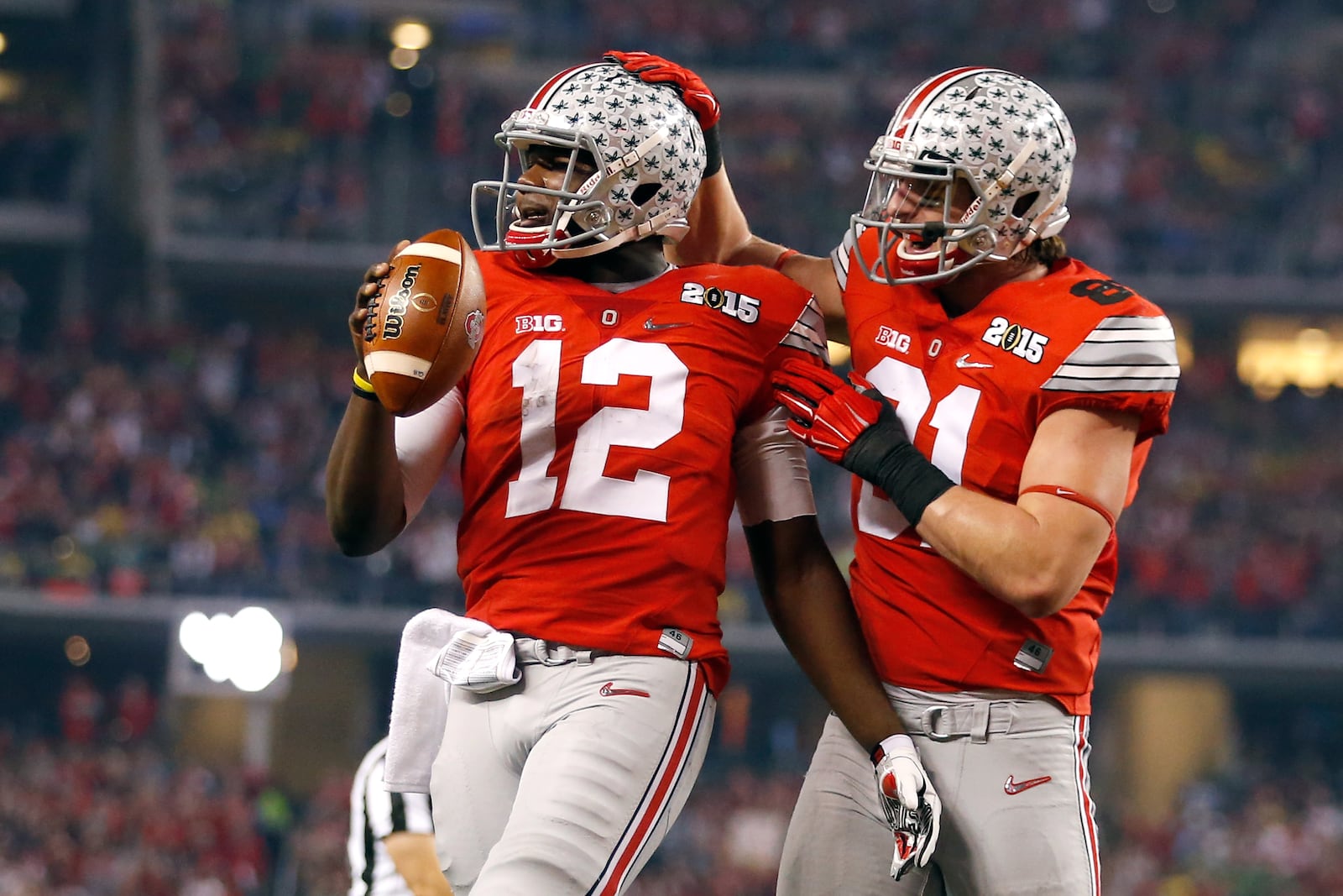 ARLINGTON, TX - JANUARY 12:  Quarterback Cardale Jones #12 of the Ohio State Buckeyes celebrates after scoring a one yard touchdown in the second quarter against the Oregon Ducks during the College Football Playoff National Championship Game at AT&T Stadium on January 12, 2015 in Arlington, Texas.  (Photo by Christian Petersen/Getty Images)