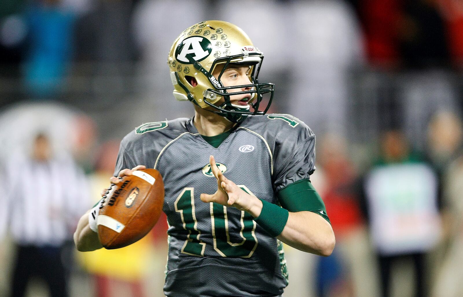 Joe Burrow, pictured here against Toledo Central Catholic in the Division III state championship game in 2014, scored a playoff win over Springfield Shawnee as a sophomore in 2012. Ohio High School Athletic Association photo