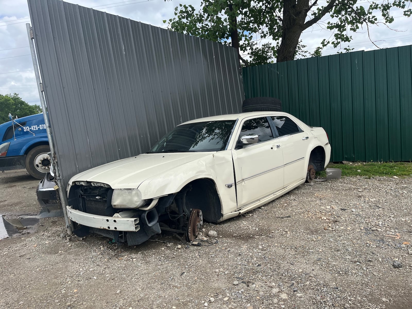 A junked car outside of a fence surrounding a property at 1801 Valley St., in Old North Dayton. The property for years was a junk yard. CORNELIUS FROLIK / STAFF