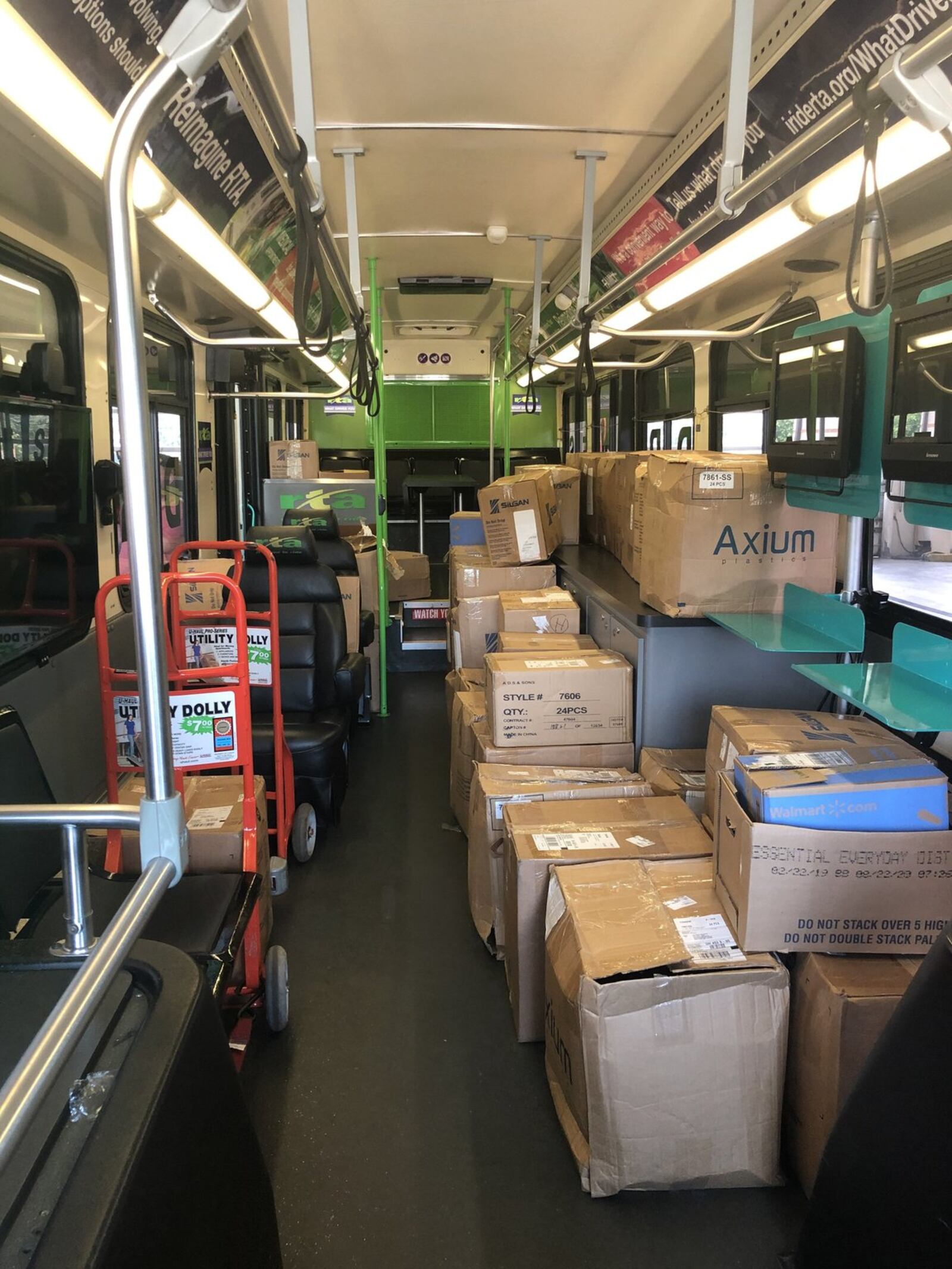 Volunteers with the Alpha Kappa Alpha help unload a bus full of school supplies to be donated to Trotwood students.