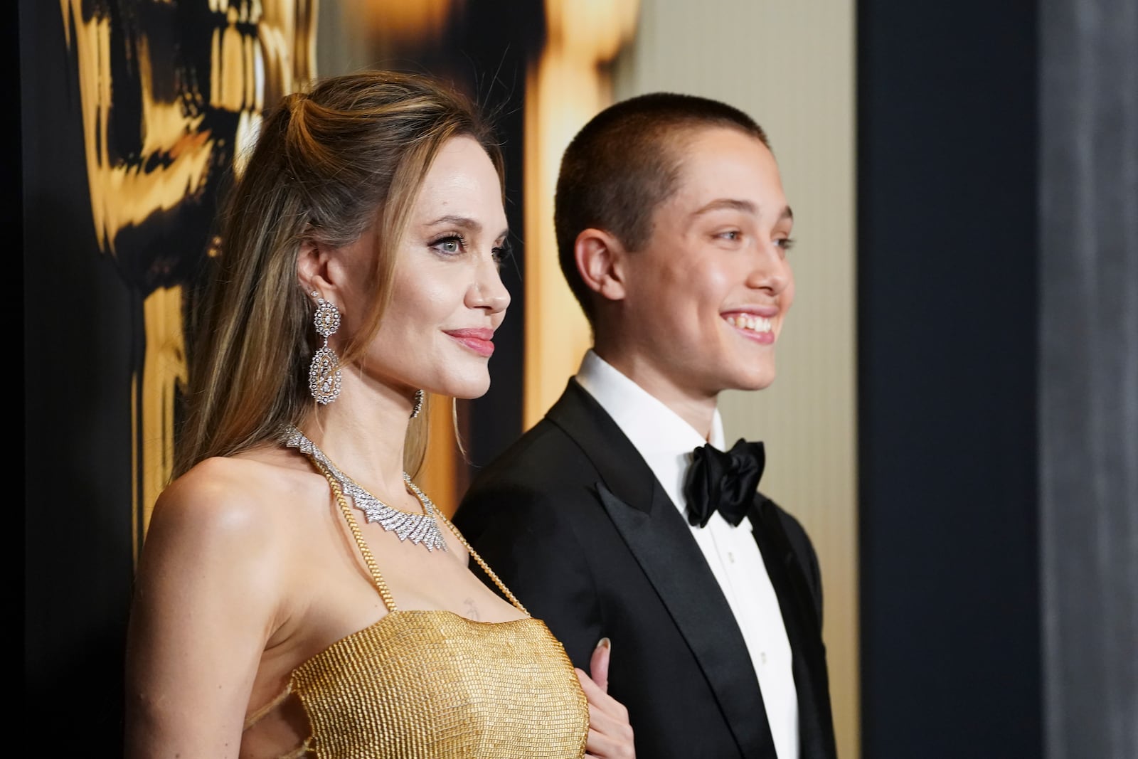 Angelina Jolie, left, and Knox Leon Jolie-Pitt arrive at the 15th Governors Awards on Sunday, Nov. 17, 2024, at The Ray Dolby Ballroom in Los Angeles. (Photo by Jordan Strauss/Invision/AP)