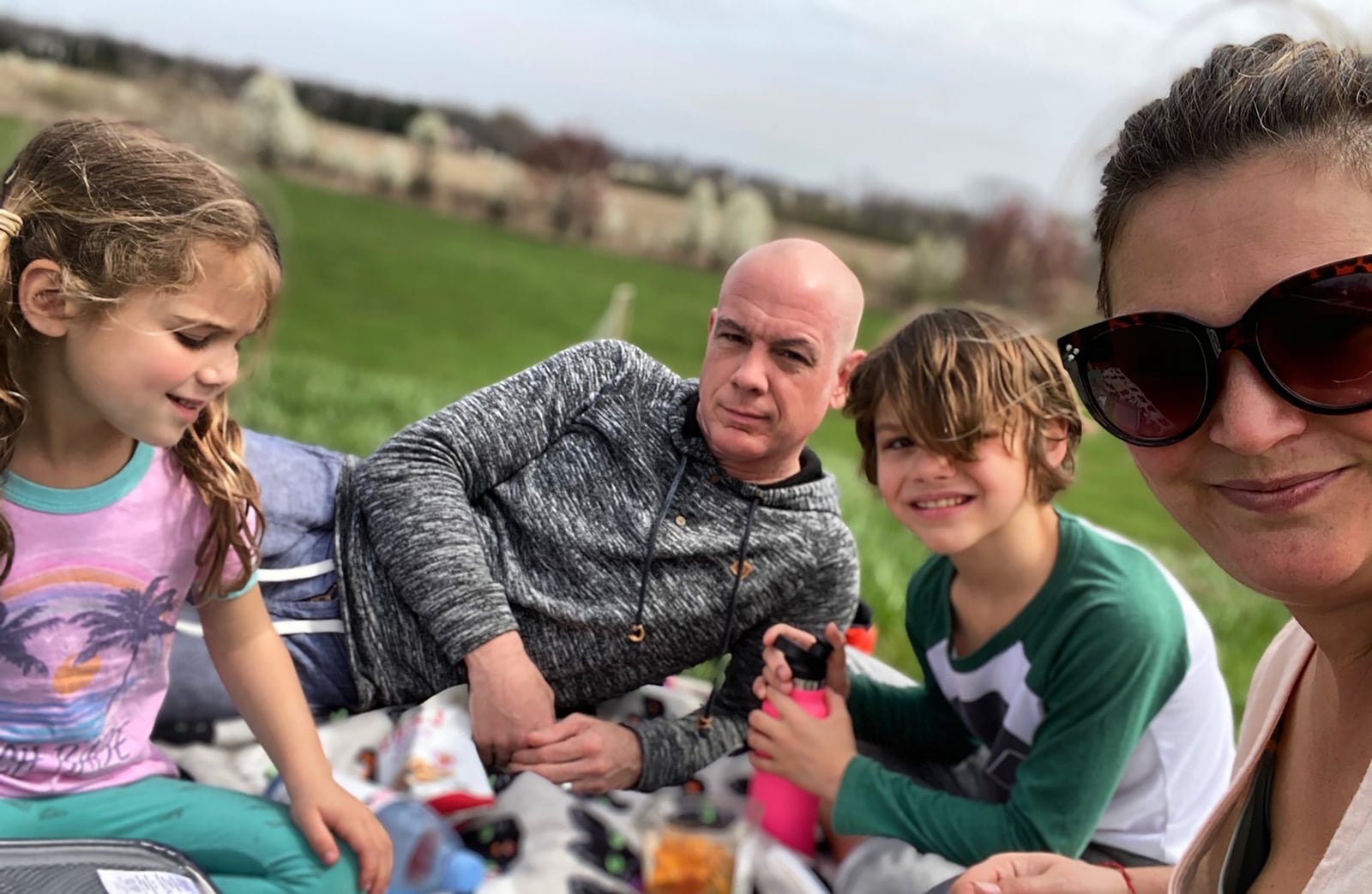 From left, Miro, Chris, Miles and Monica Deal decided to take advantage of the gorgeous spring weather and have a picnic lunch outside that featured healthy snacks the kids love like fresh fruit and peanut butter for dipping. CONTRIBUTED