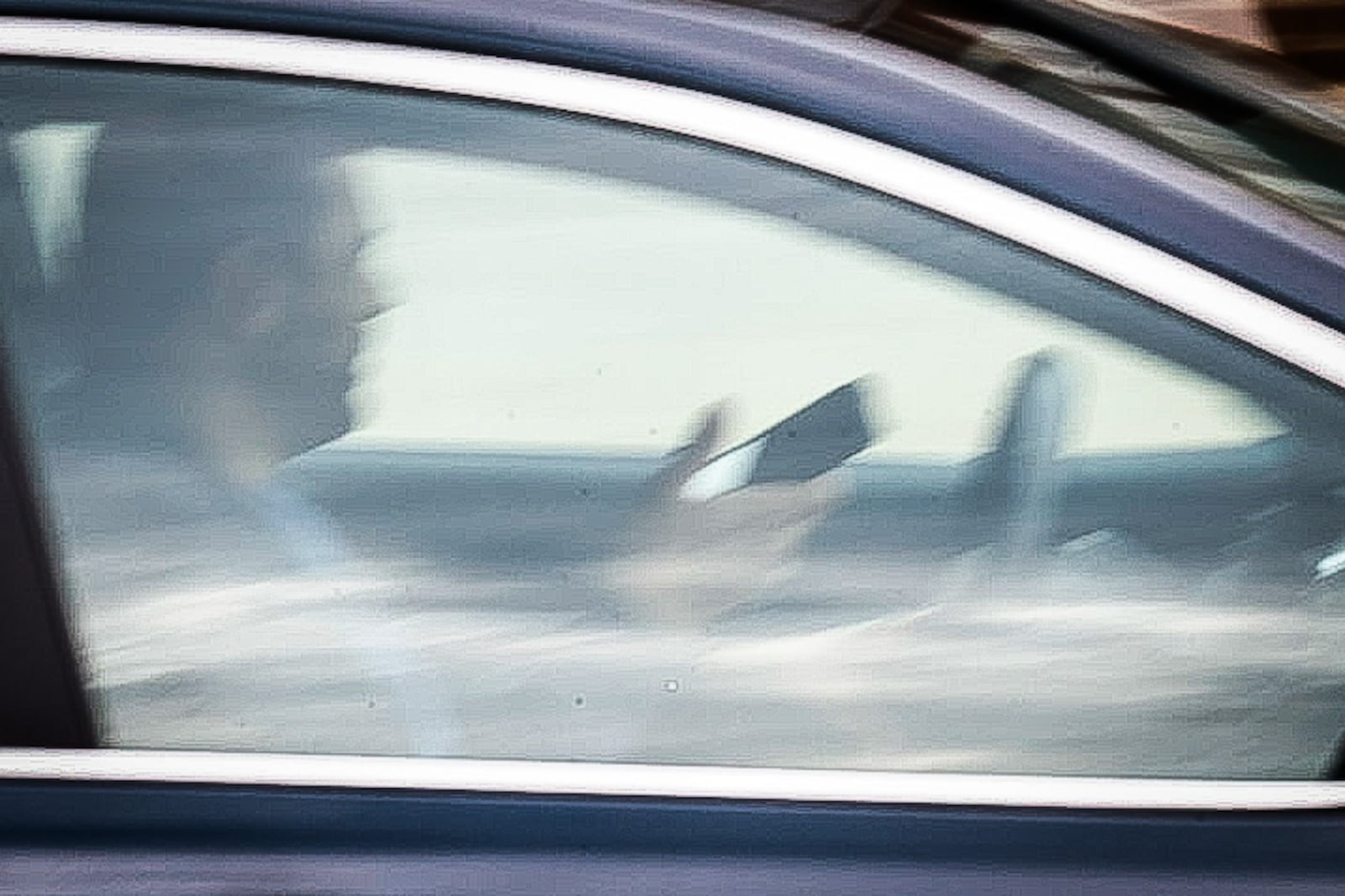 A driver on Brown Street appears to be using an electronic device Thursday, Aug. 17, 2023. Police in Ohio have been issuing warnings only under a new, tougher distracted driving law for four months, but the warning period ends Oct. 5. JIM NOELKER/STAFF