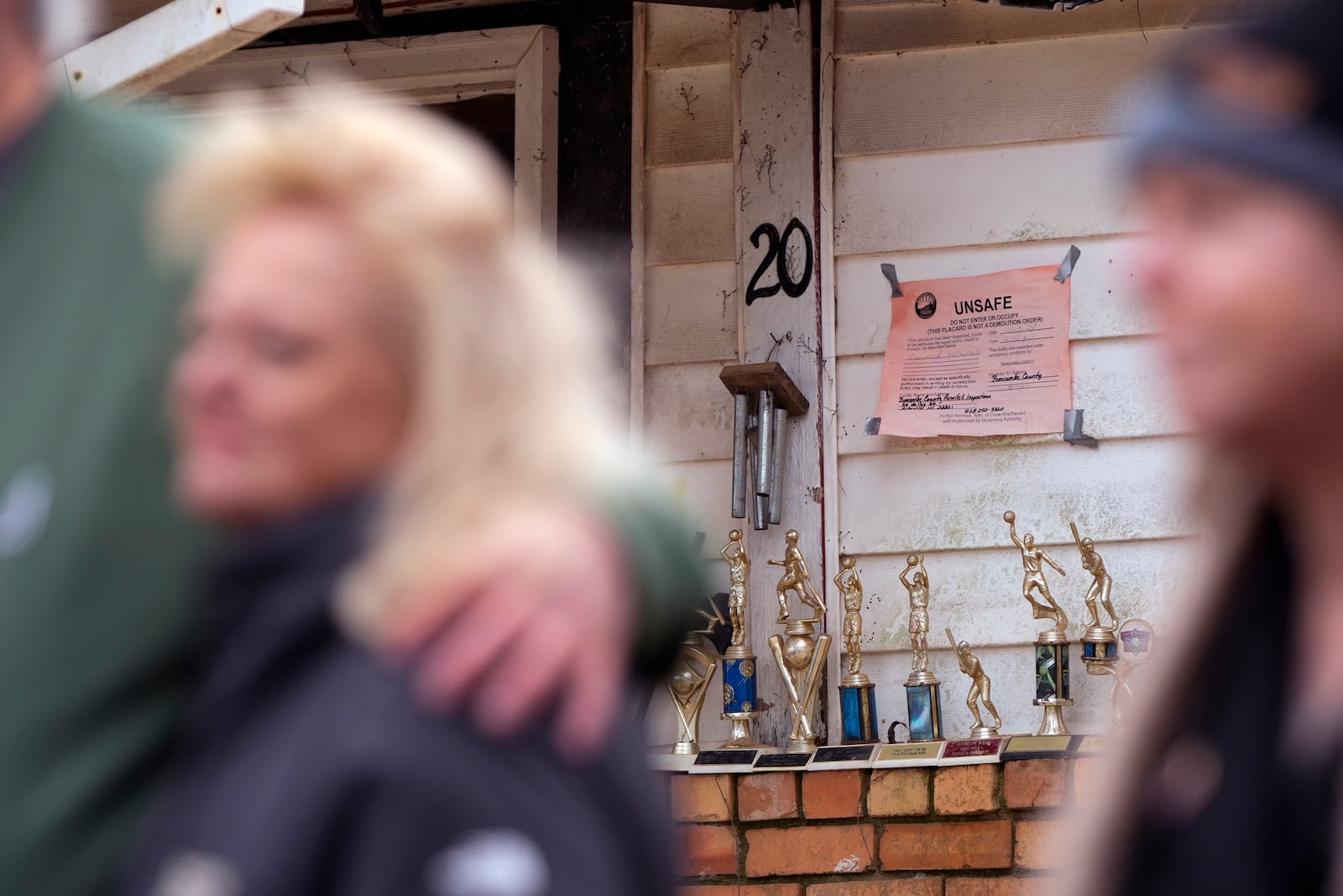 President Donald Trump and first lady Melania Trump meet with homeowners affected by Hurricane Helene in Swannanoa, N.C., Friday, Jan. 24, 2025. (AP Photo/Mark Schiefelbein)