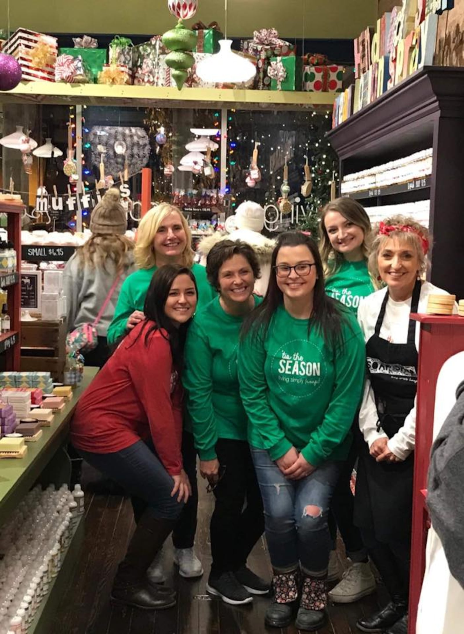 Tanya Brown (far right in black apron) with members of her team at Living Simply in Tipp City in November 2018.