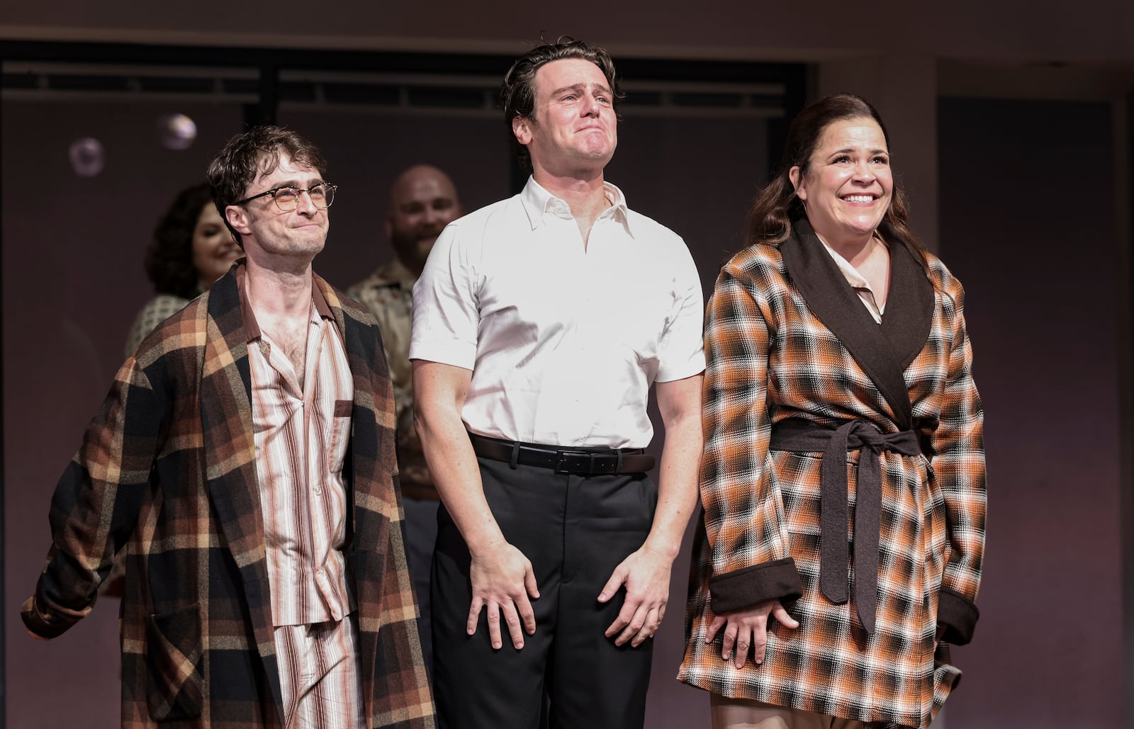 Daniel Radcliffe, left, Jonathan Groff and Lindsay Mendez participate in the curtain call during Broadway's celebration of "Merrily We Roll Along," at the Hudson Theatre, Sunday, Oct. 8, 2023, in New York. (Photo by CJ Rivera/Invision/AP)