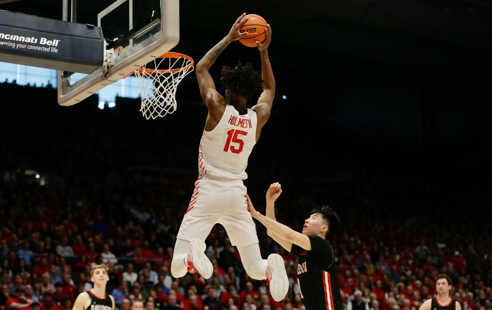 Dayton's DaRon Holmes II dunks against Davidson on Saturday, March 5, 2022, at UD Arena. David Jablonski/Staff