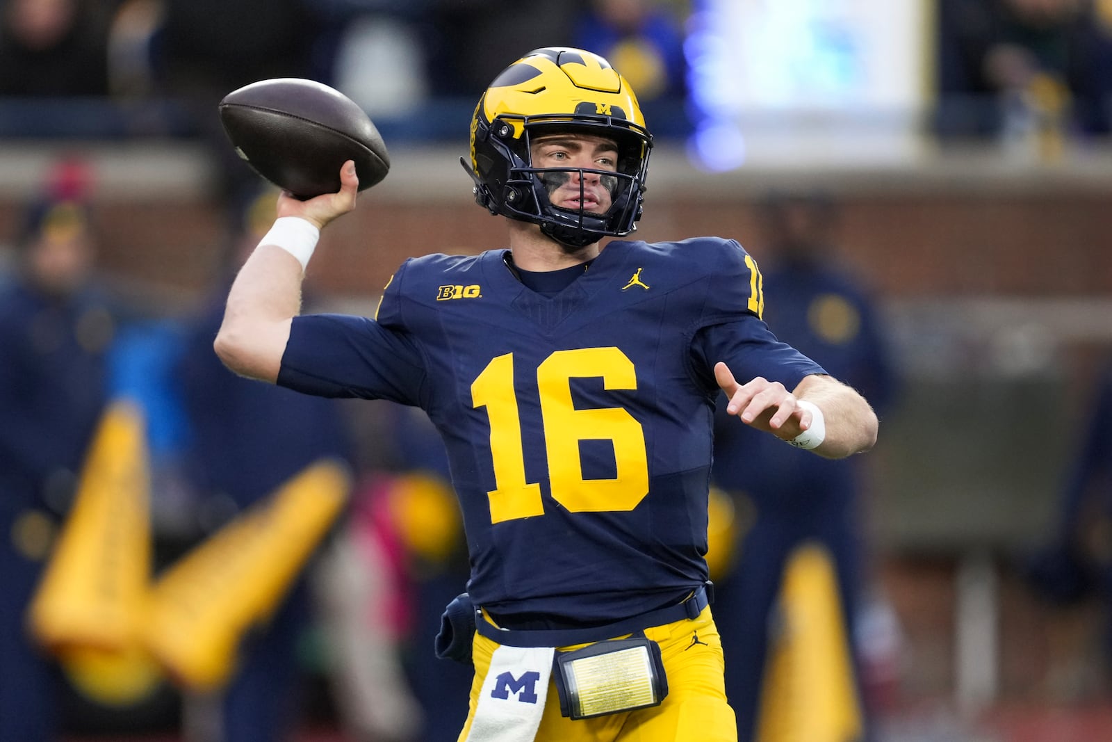 Michigan quarterback Davis Warren throws against Northwestern in the first half of an NCAA college football game in Ann Arbor, Mich., Saturday, Nov. 23, 2024. (AP Photo/Paul Sancya)