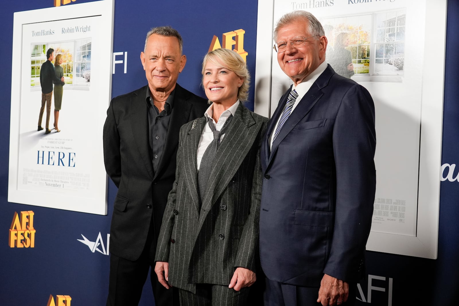 Tom Hanks, from left, Robin Wright, and Robert Zemeckis arrive at the AFI Fest premiere of "Here" on Friday, Oct. 25, 2024, at TCL Chinese Theatre in Los Angeles. (AP Photo/Chris Pizzello)