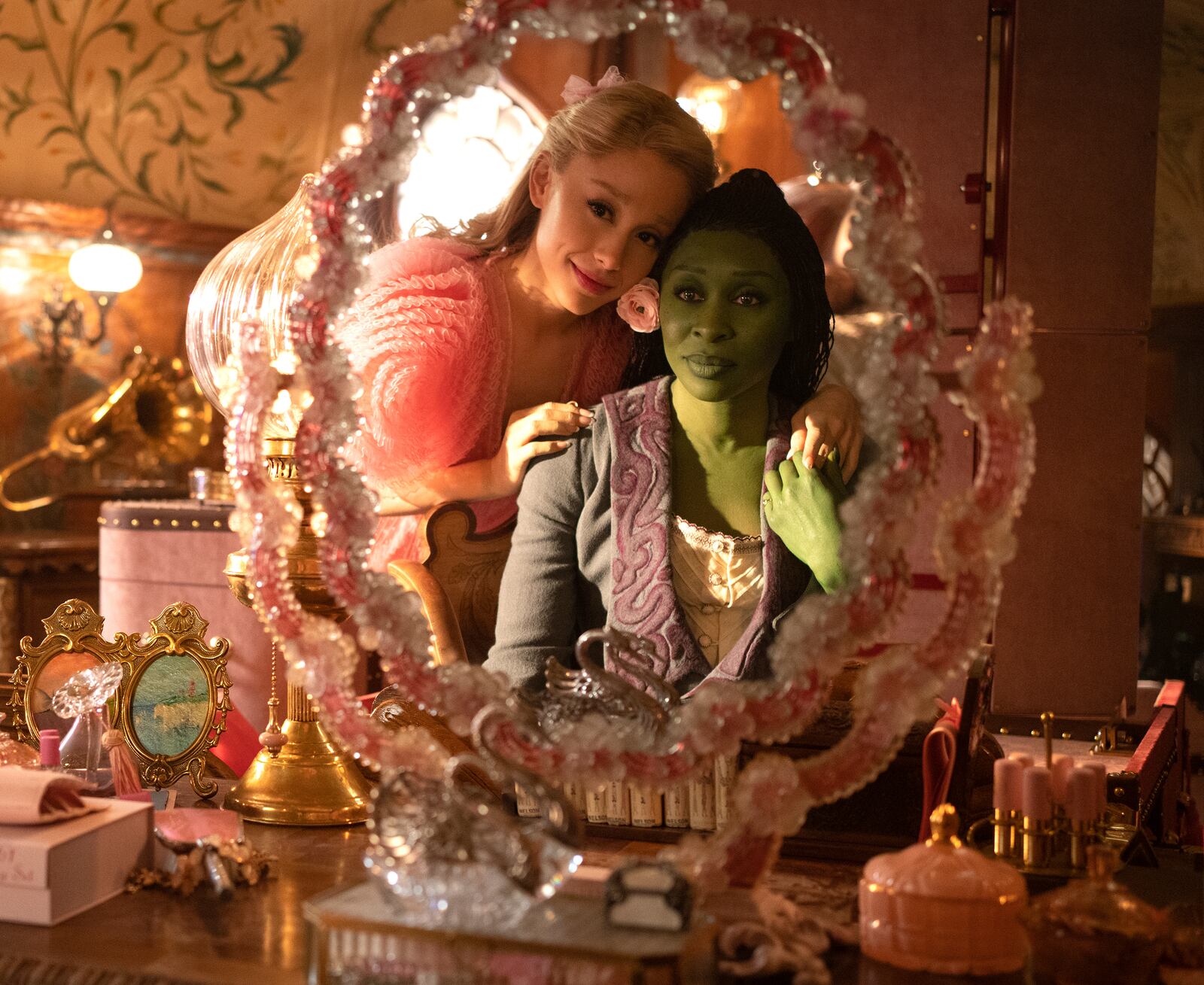 This image released by Universal Pictures shows Ariana Grande, as Glinda, left, and Cynthia Erivo, as Elphaba, in a scene from the film "Wicked." (Giles Keyte/Universal Pictures via AP)