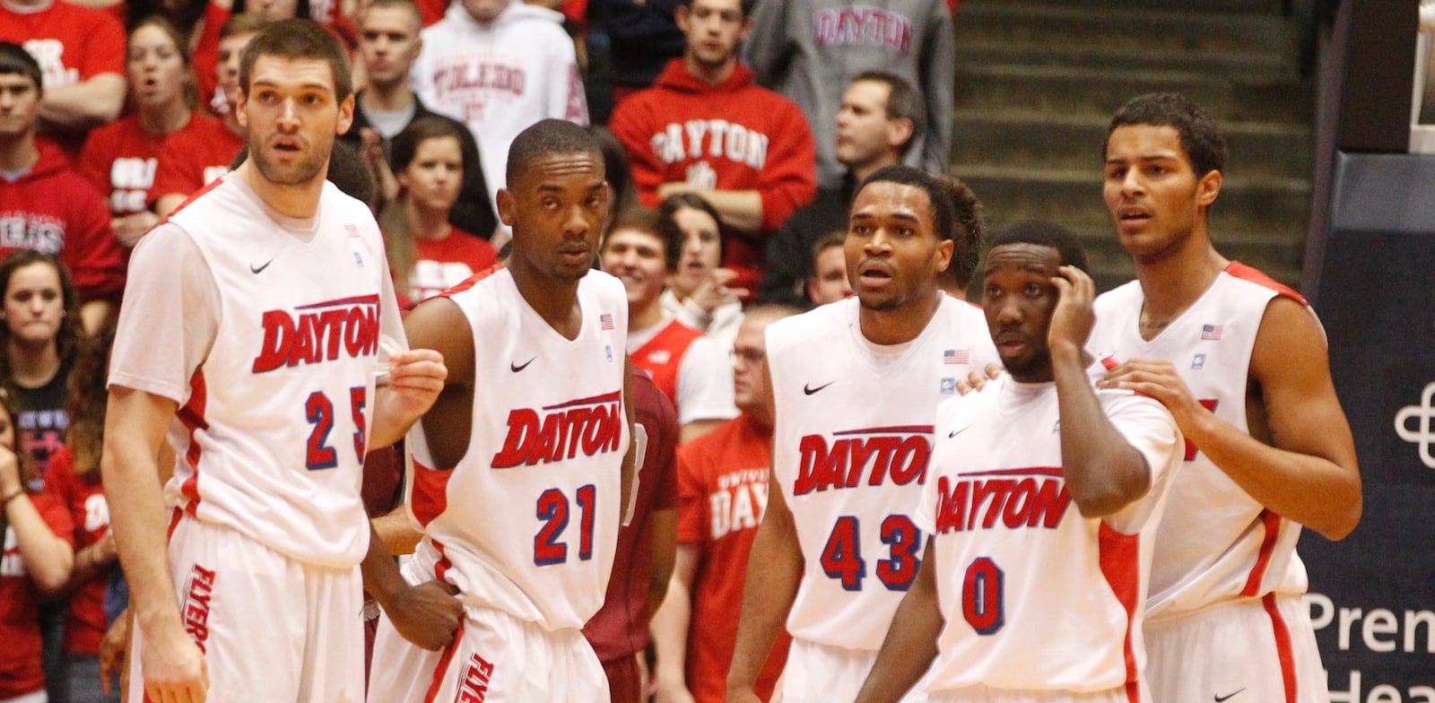 Dayton's Alex Gavrilovic, Dyshawn Pierre, Vee Sanford, Khari Price and Devin Oliver look to the bench for instruction during a game against Saint Joseph's on Wednesday, Jan. 29, 2014, at UD Arena. David Jablonski/Staff