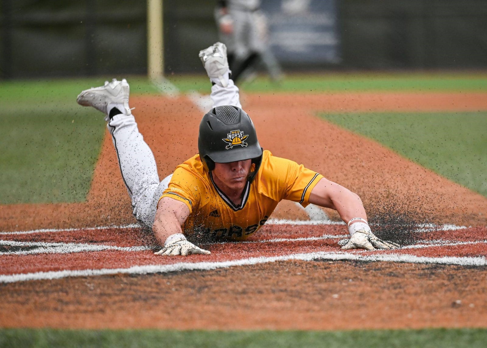 NKU's Colton Kucera slides into home during a game this season. NKU Athletics photo