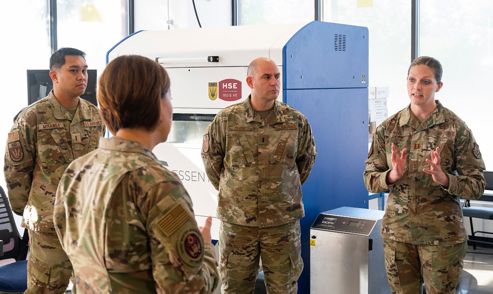 Capt. Kristina Wood (right), Air Force Life Cycle Management Center Rapid Sustainment Office Advance Manufacturing Program, briefs Chief Master Sgt. of the Air Force JoAnne S. Bass on the use of 3D printing to manufacture parts on June 16. AMPO is the Air Force’s focal point for the application of advanced manufacturing in areas related to acquisition and sustainment. U.S. AIR FORCE PHOTO/R.J. ORIEZ