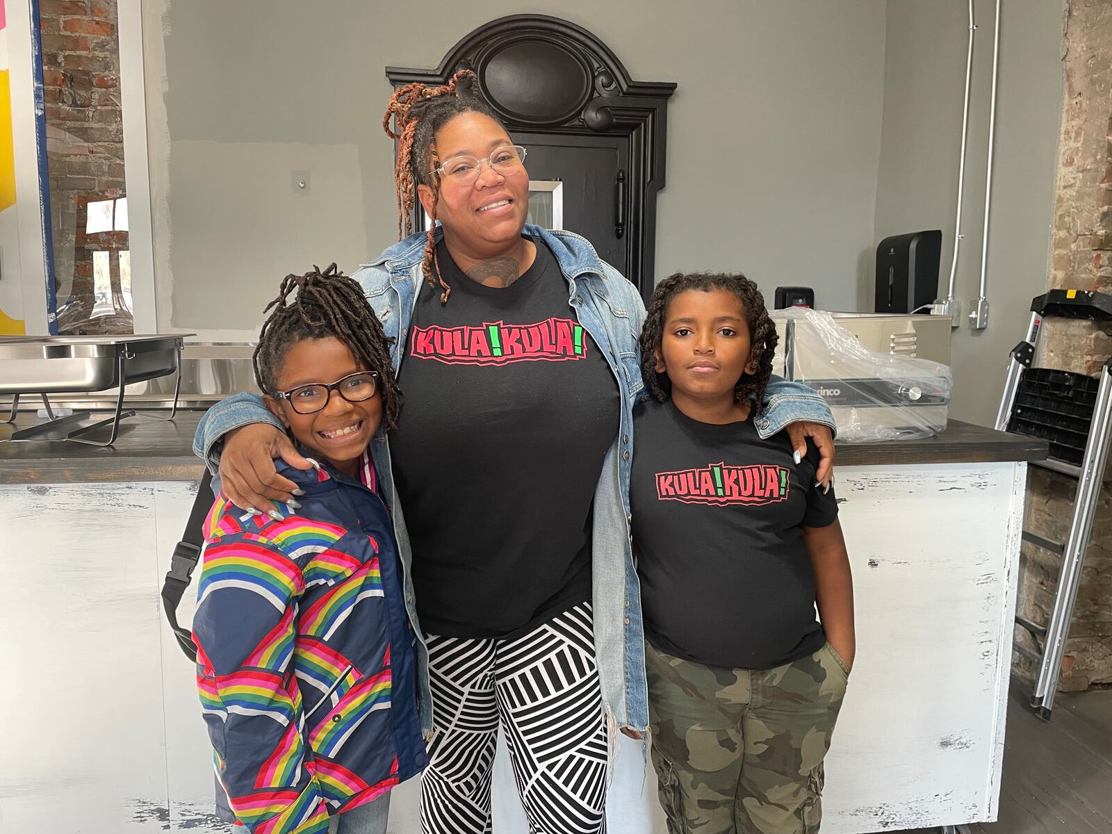 Vendors were getting ready Wednesday afternoon for the soft opening of District Market kicking off Thursday, Dec. 1. Pictured is Ashaki Daugherty, owner of Kula Kula, with her 8-year-old twins.