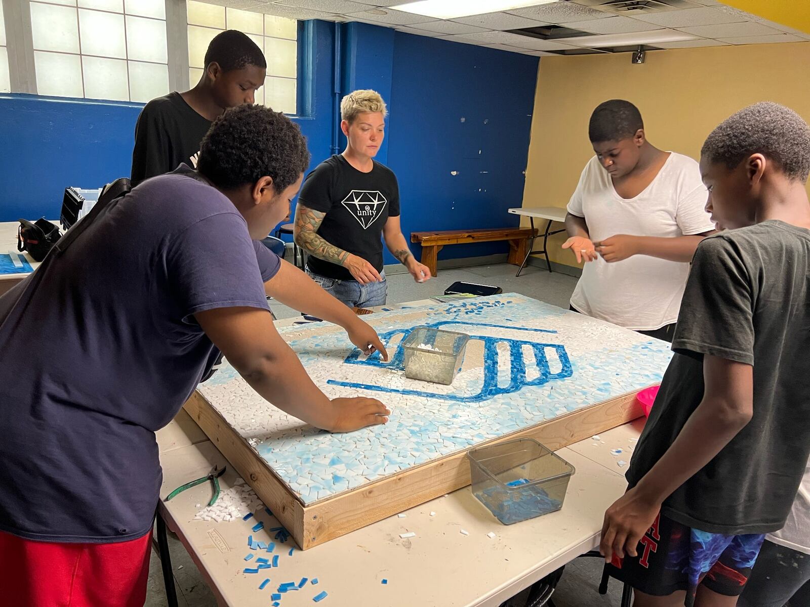 The Boys and Girls Club of Dayton work on a mural project. CONTRIBUTED