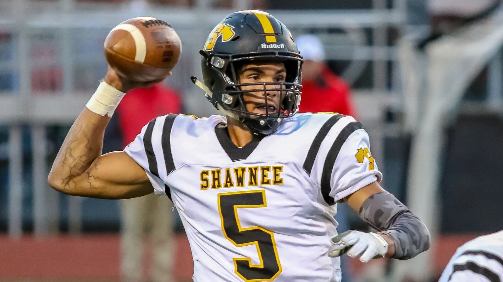 Shawnee High School senior Robie Glass throws a pass during the first quarter of their game on Friday night at AcuSport Stadium. The Braves won 36-29. CONTRIBUTED PHOTO BY MICHAEL COOPER