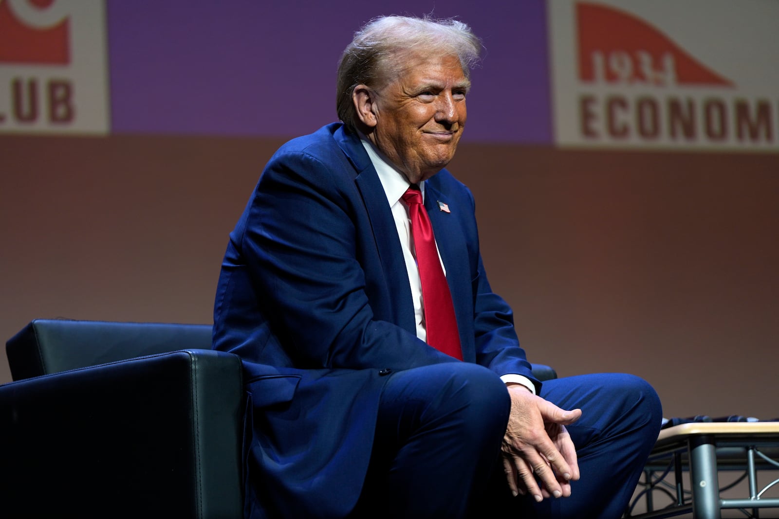 Republican presidential nominee former President Donald Trump listens as he answers questions at a meeting of the Detroit Economic Club, Thursday, Oct. 10, 2024, in Detroit. (AP Photo/Julia Demaree Nikhinson)