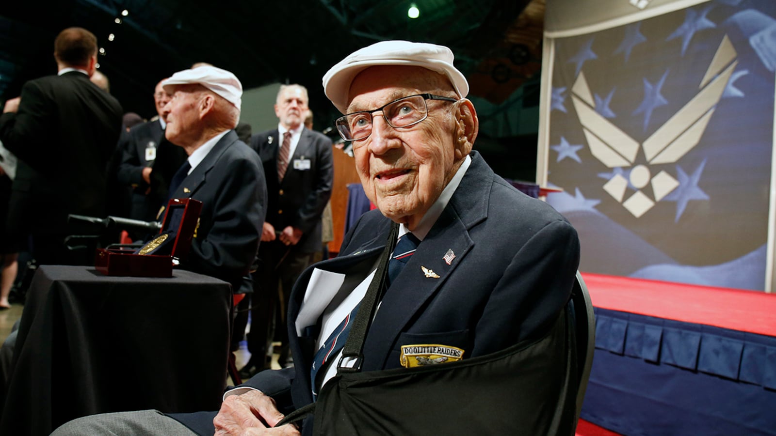 In this April 18, 2015, file photo, two members of the Doolittle Tokyo Raiders, retired U.S. Air Force Lt. Col. Richard "Dick" Cole, seated front, and retired Staff Sgt. David Thatcher, seated left, pose for photos after the presentation of a Congressional Gold Medal honoring the Doolittle Tokyo Raiders at the National Museum of the U.S. Air Force at Wright-Patterson Air Force Base in Dayton, Ohio. Retired Lt. Col. Richard "Dick" Cole, the last of the 80 Doolittle Tokyo Raiders who carried out the daring U.S. attack on Japan during World War II, died Tuesday at a military hospital in Texas.